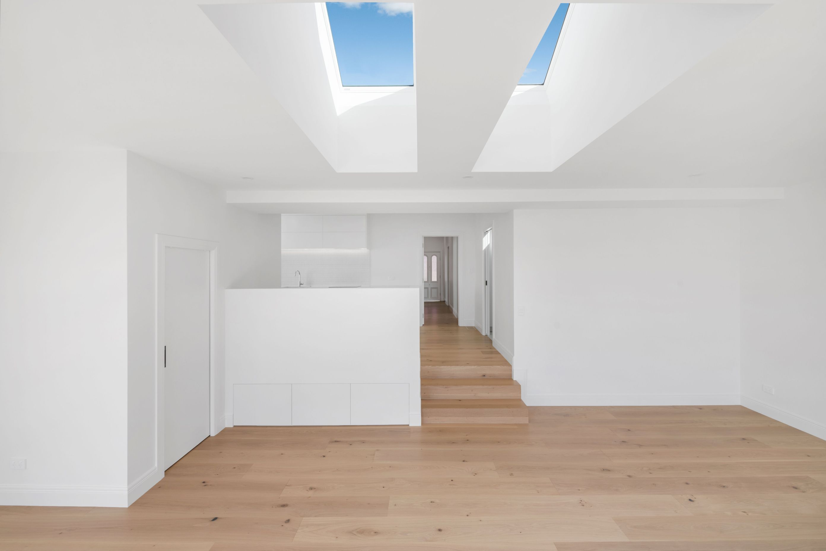 We turned the old lounge into a master suite. Added an ensuite, sorted the levels, and brought light and calm into what used to be a dark front room.