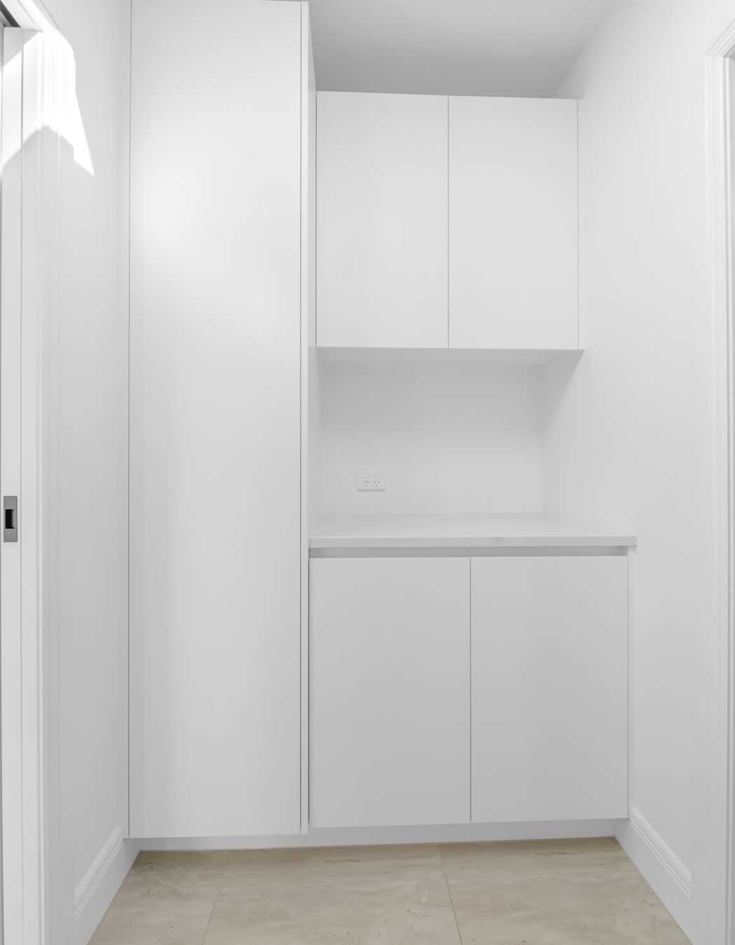 Custom cabinetry here keeps everything tucked away,  lean lines, soft-close drawers, and plenty of space without taking over the room.