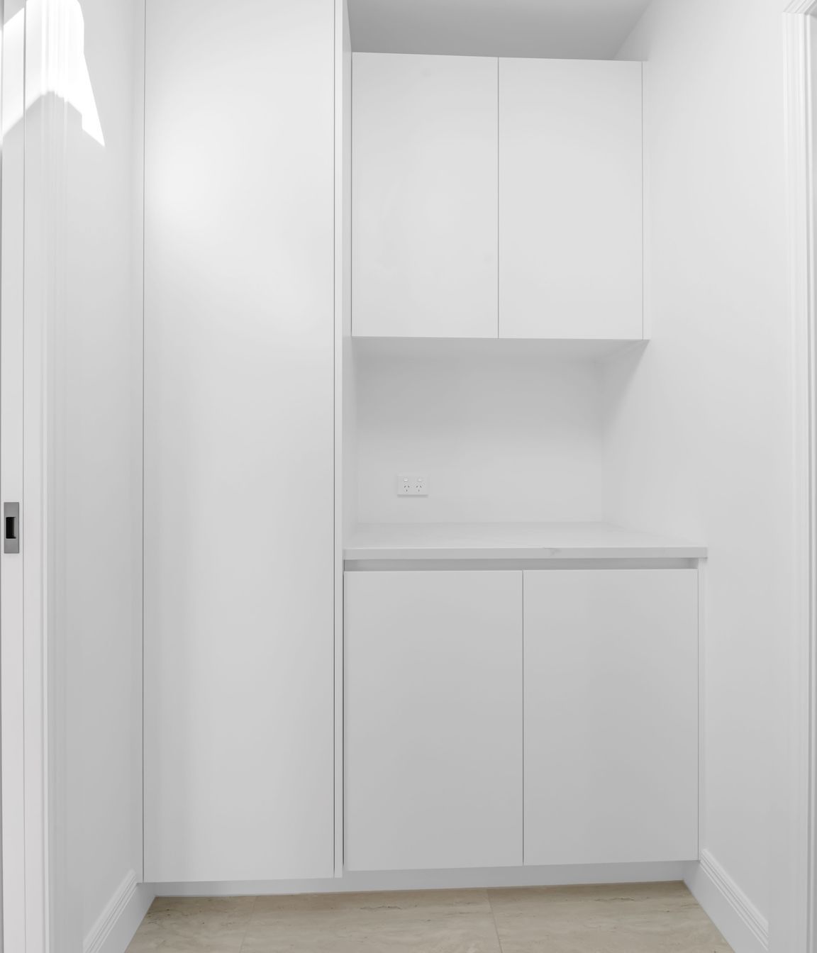 Custom cabinetry here keeps everything tucked away,  lean lines, soft-close drawers, and plenty of space without taking over the room.