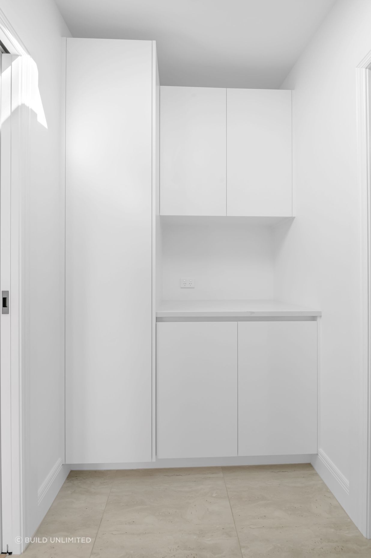 Custom cabinetry here keeps everything tucked away,  lean lines, soft-close drawers, and plenty of space without taking over the room.