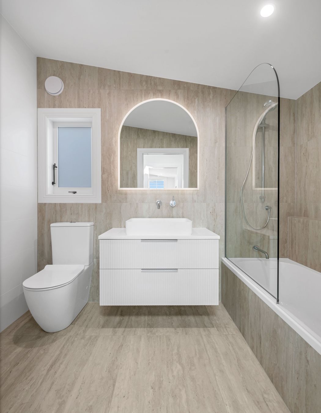 Doesn’t scream for attention, just feels right. Simple lines, warm tones, and tapware that does the job without fuss.
