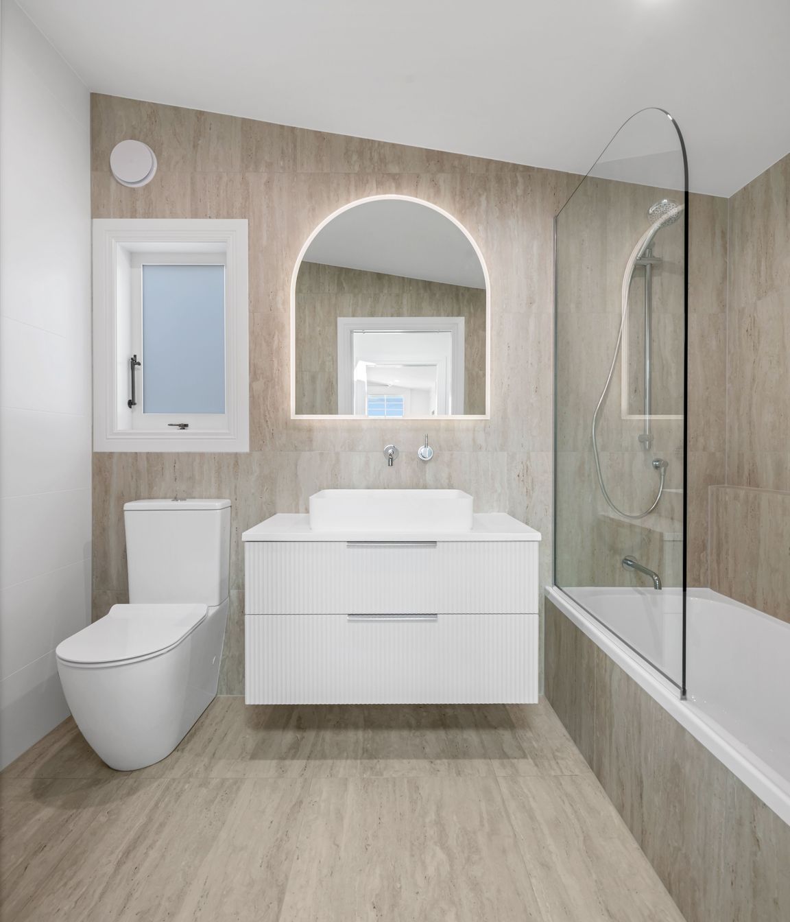Doesn’t scream for attention, just feels right. Simple lines, warm tones, and tapware that does the job without fuss.