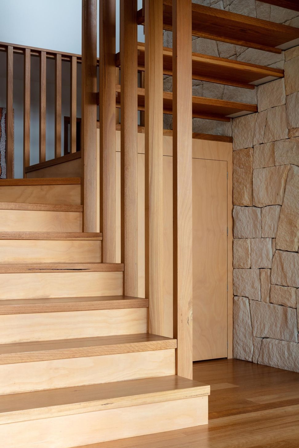 14-Matt-Day-Architect-Matt-Day-Bayview-House-Stair-Timber-Battens-Sandstone-Wall-Timber-Floor.jpg