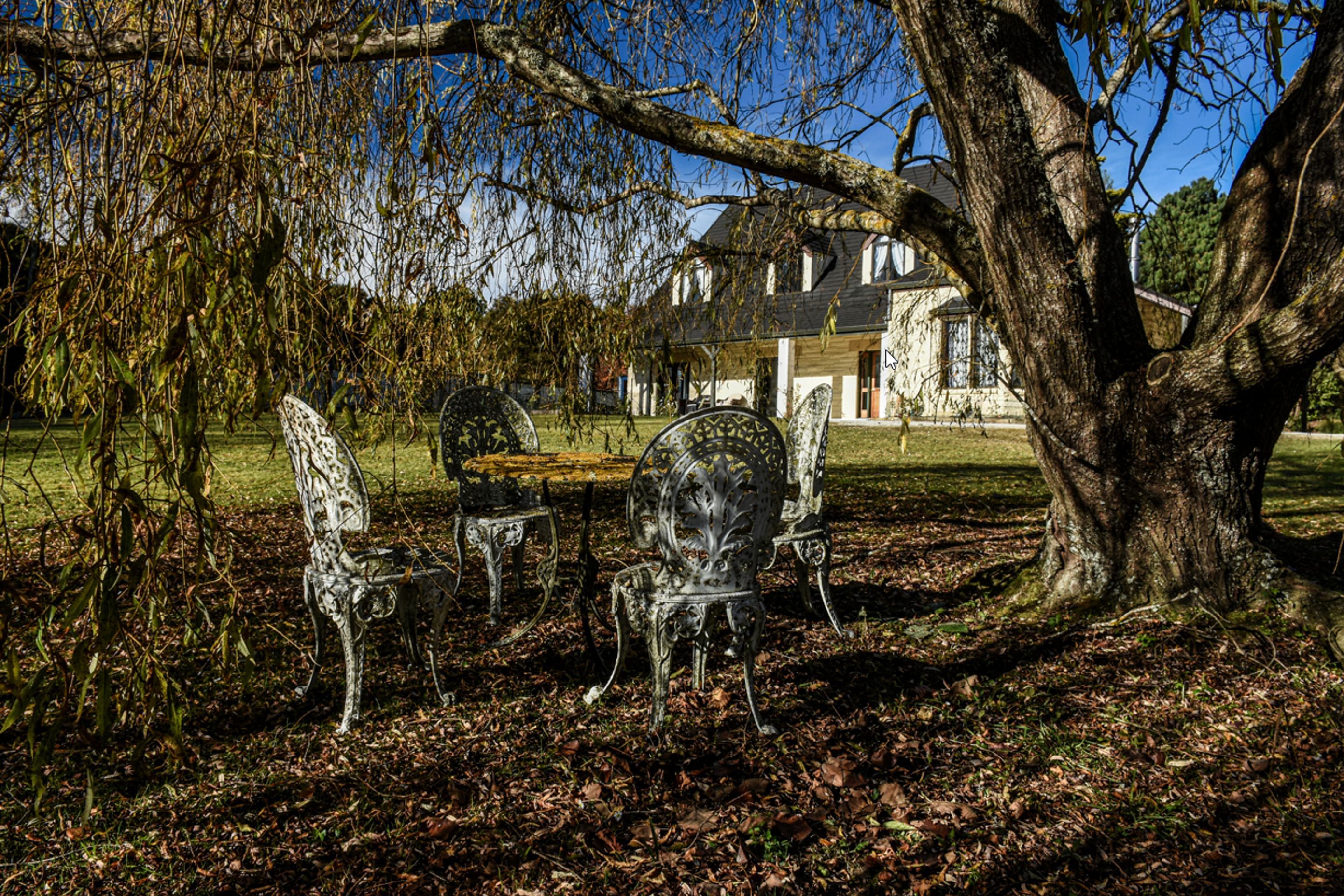 View of the fully renovated house from the garden during winter.
