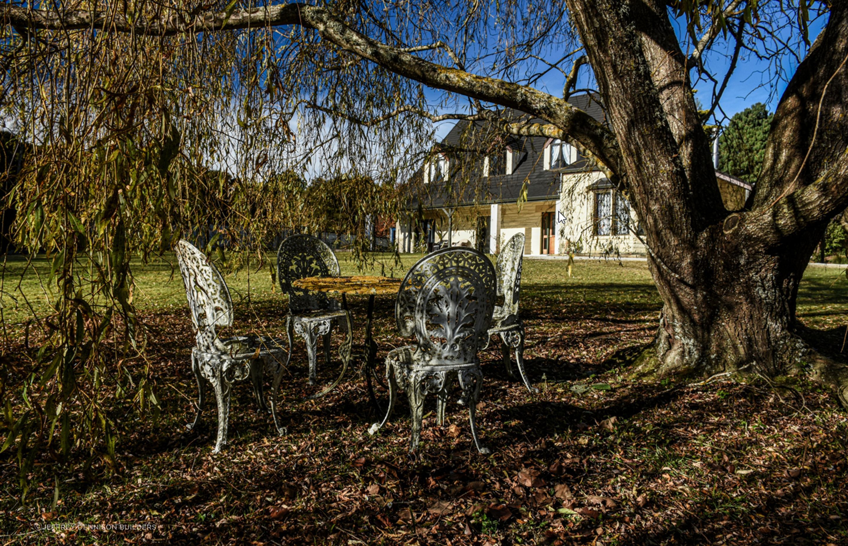 View of the fully renovated house from the garden during winter.
