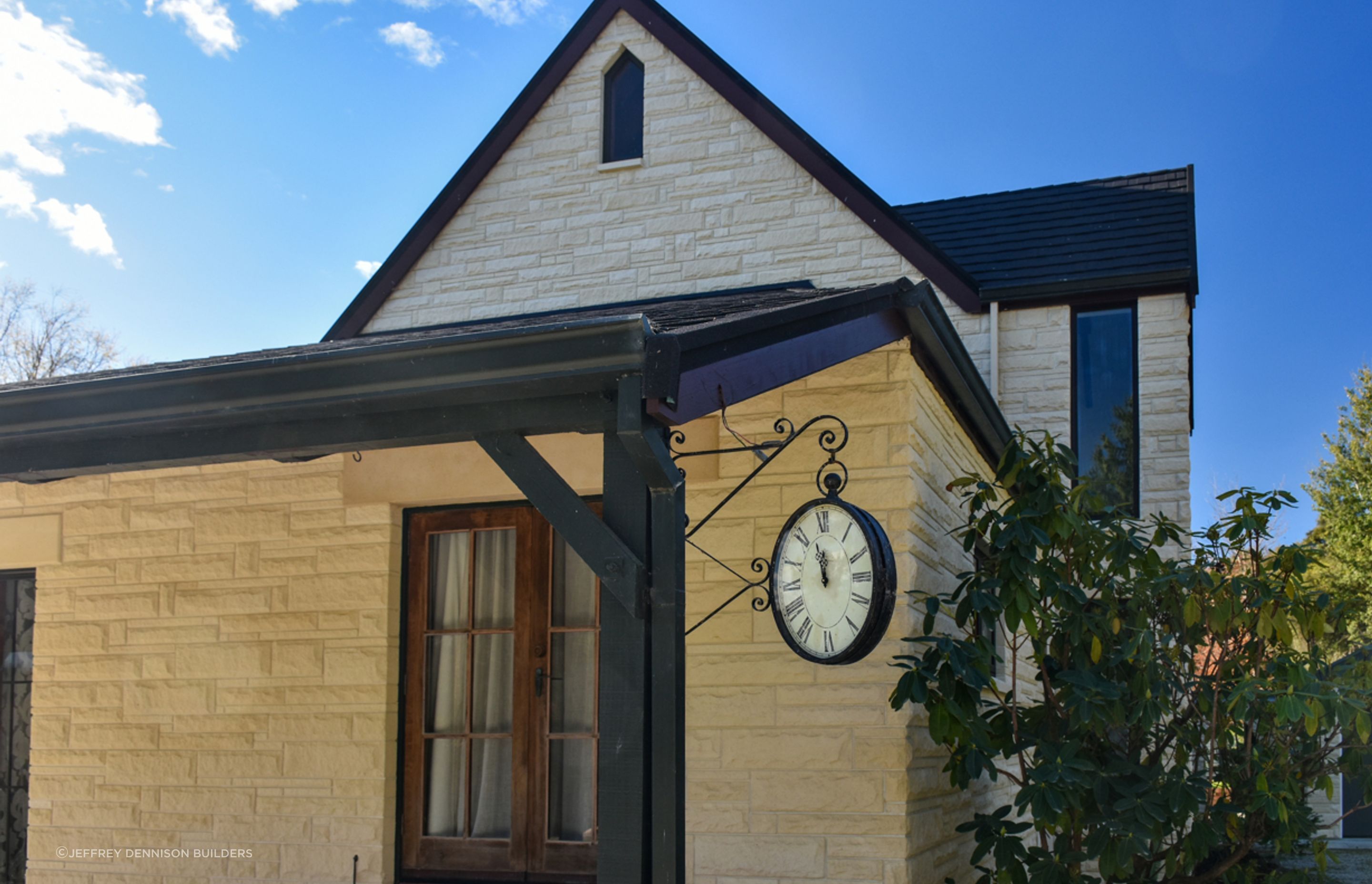Close up of restored/cleaned stonework, new bargeboards and roofing - slate alternative