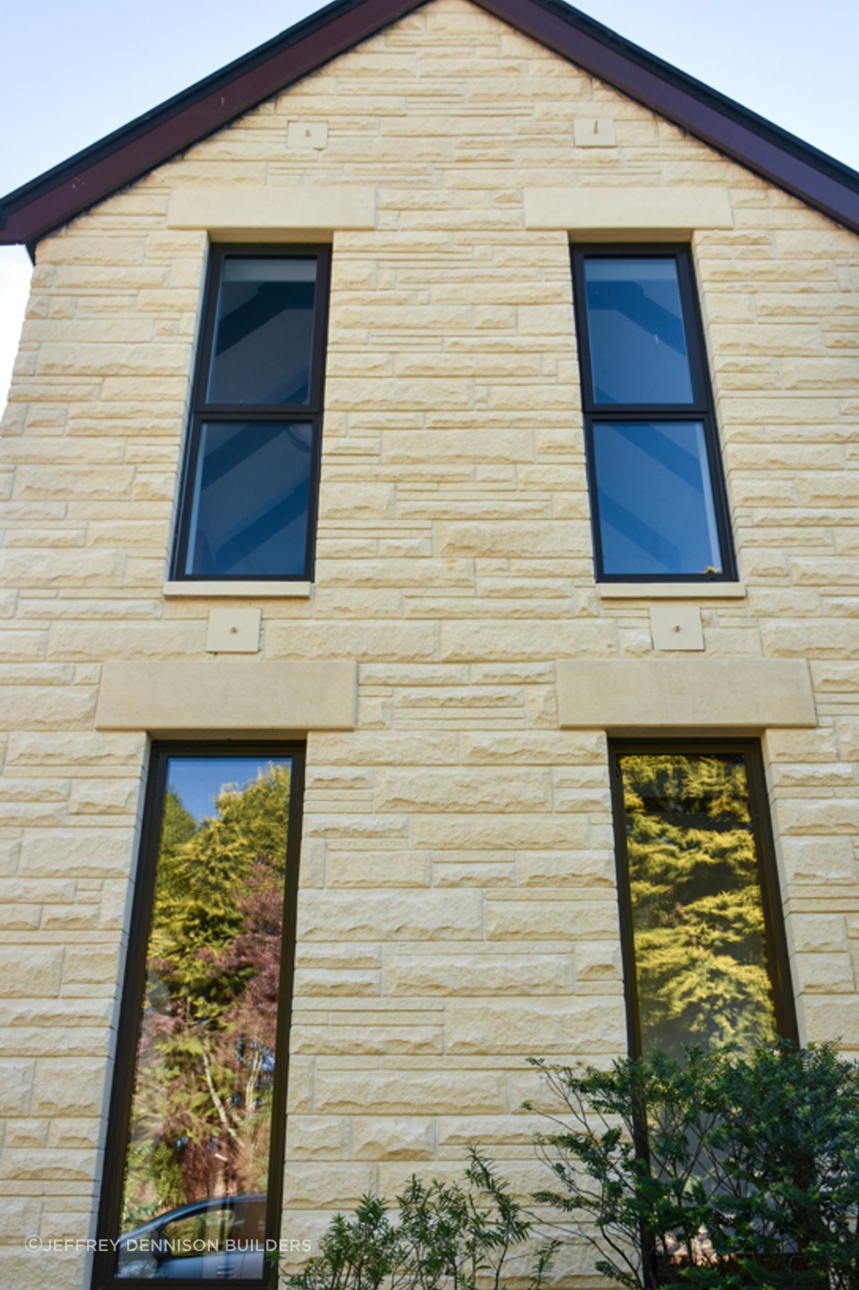 Close up of new double-glazed windows, bargeboards and cleaned/restored Oamaru stone from the courtyard