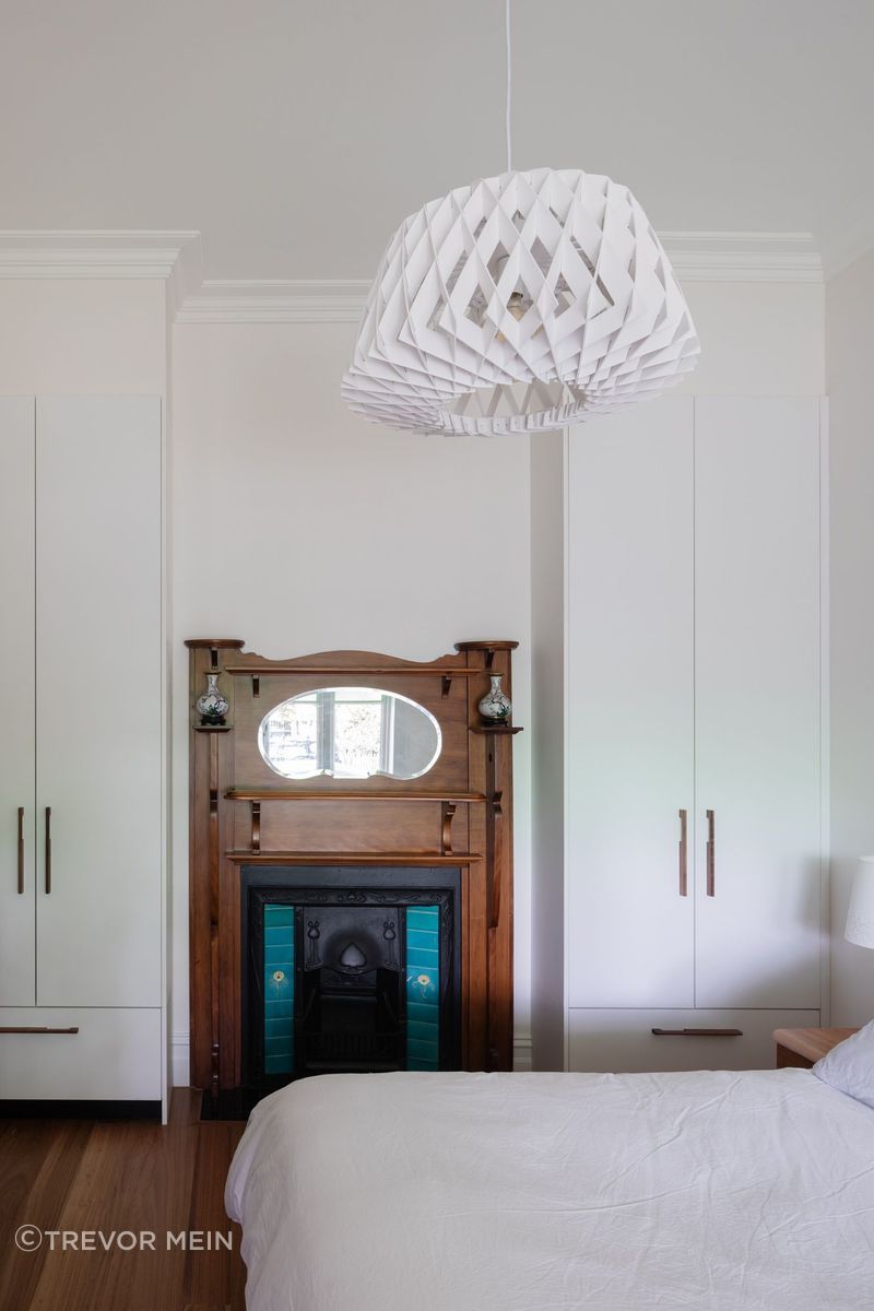 Heritage fireplace feature in bedroom