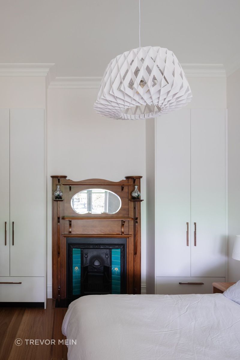 Heritage fireplace feature in bedroom