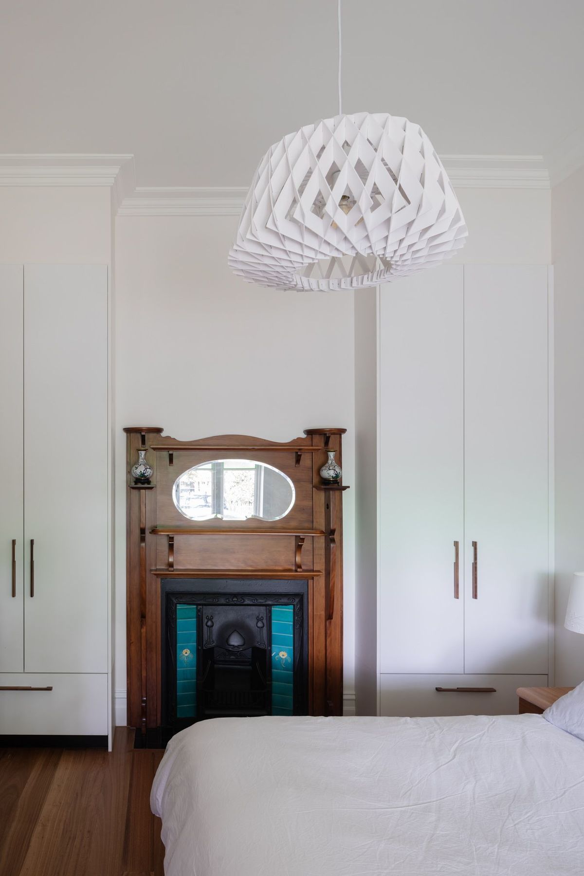 Heritage fireplace feature in bedroom