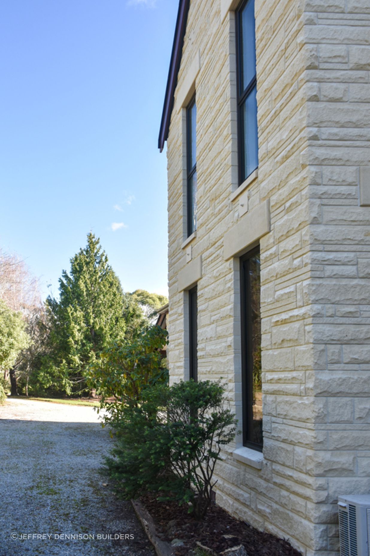 View from the courtyard showing new double-glazed windows, bargeboards and cleaned/restored Oamaru stone looking towards the sublime meandering driveway