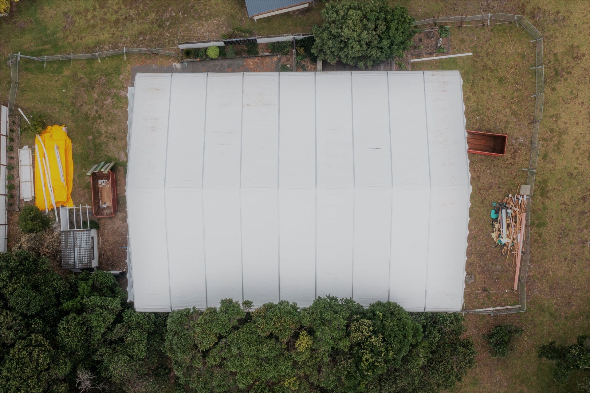 PVC sheet tarpaulins are fed into the supporting structure. They are re-usable!