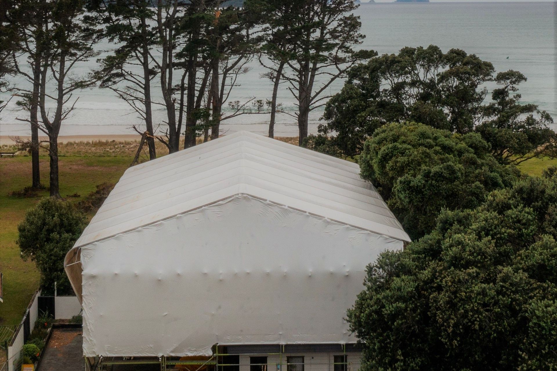 Single use Shrink-wrap was only used on the gables ends - re-usable PVC sheeting was used for the roof and walls.