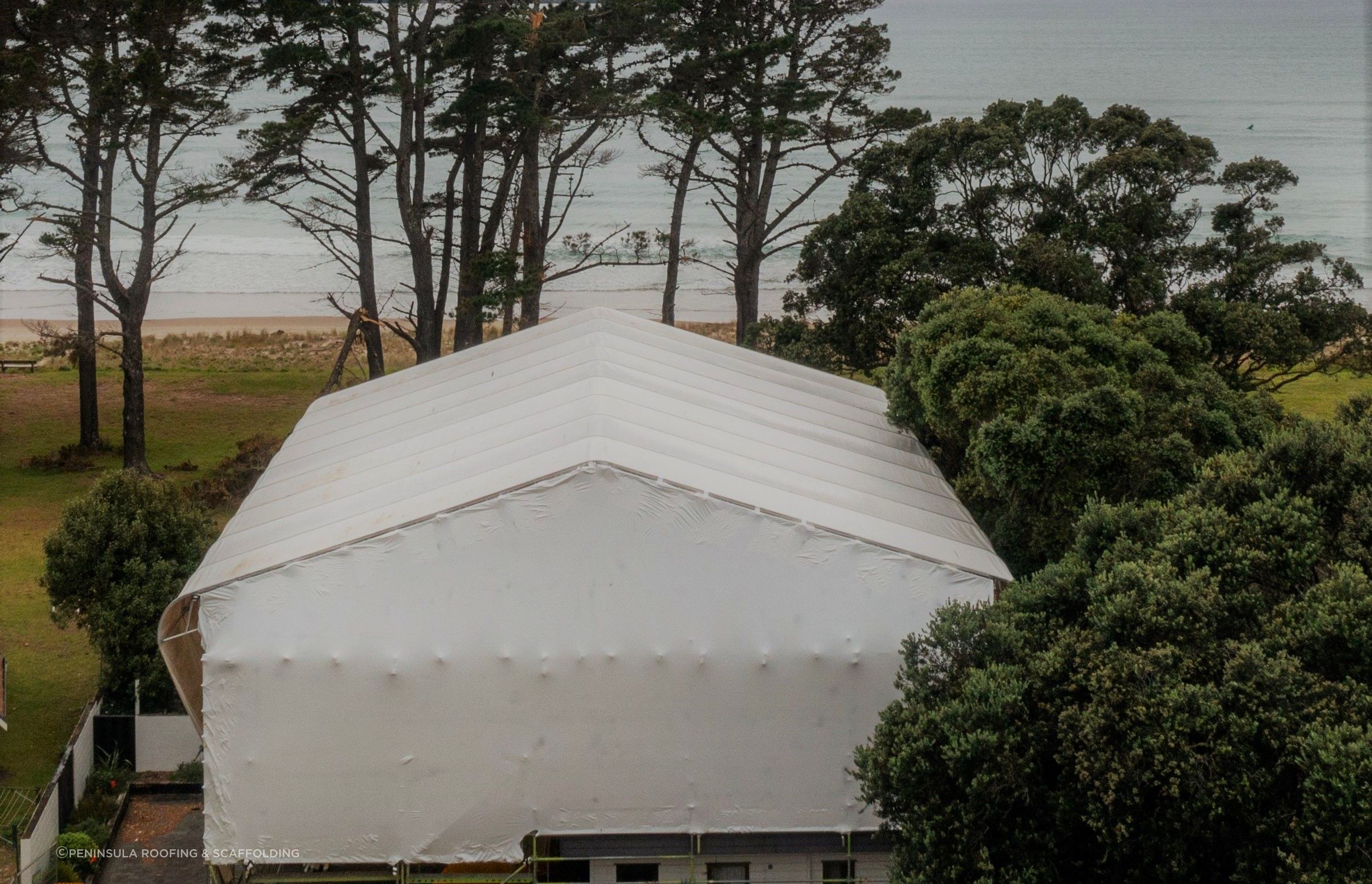 Single use Shrink-wrap was only used on the gables ends - re-usable PVC sheeting was used for the roof and walls.