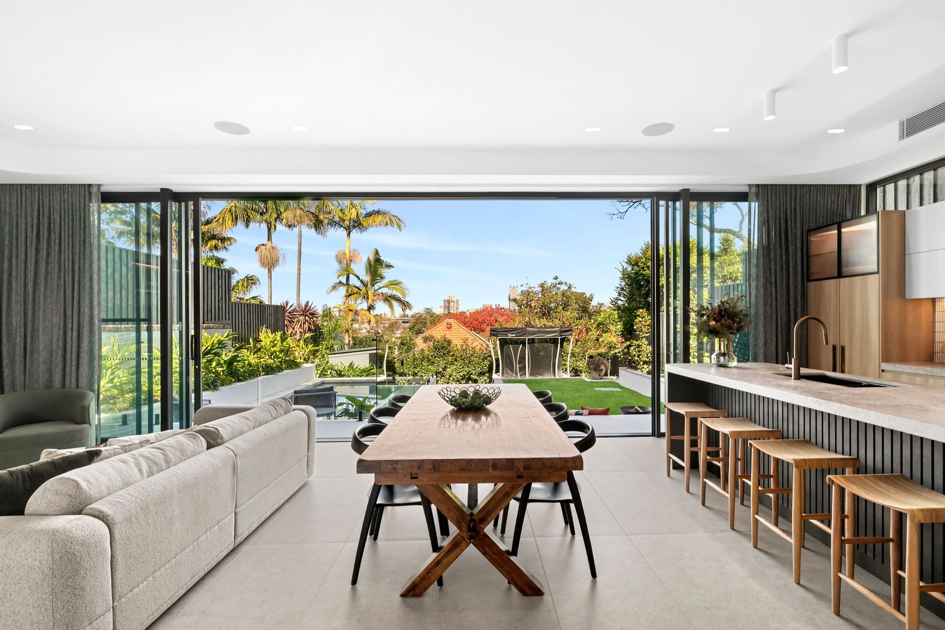 Modern living with a leafy backyard outlook