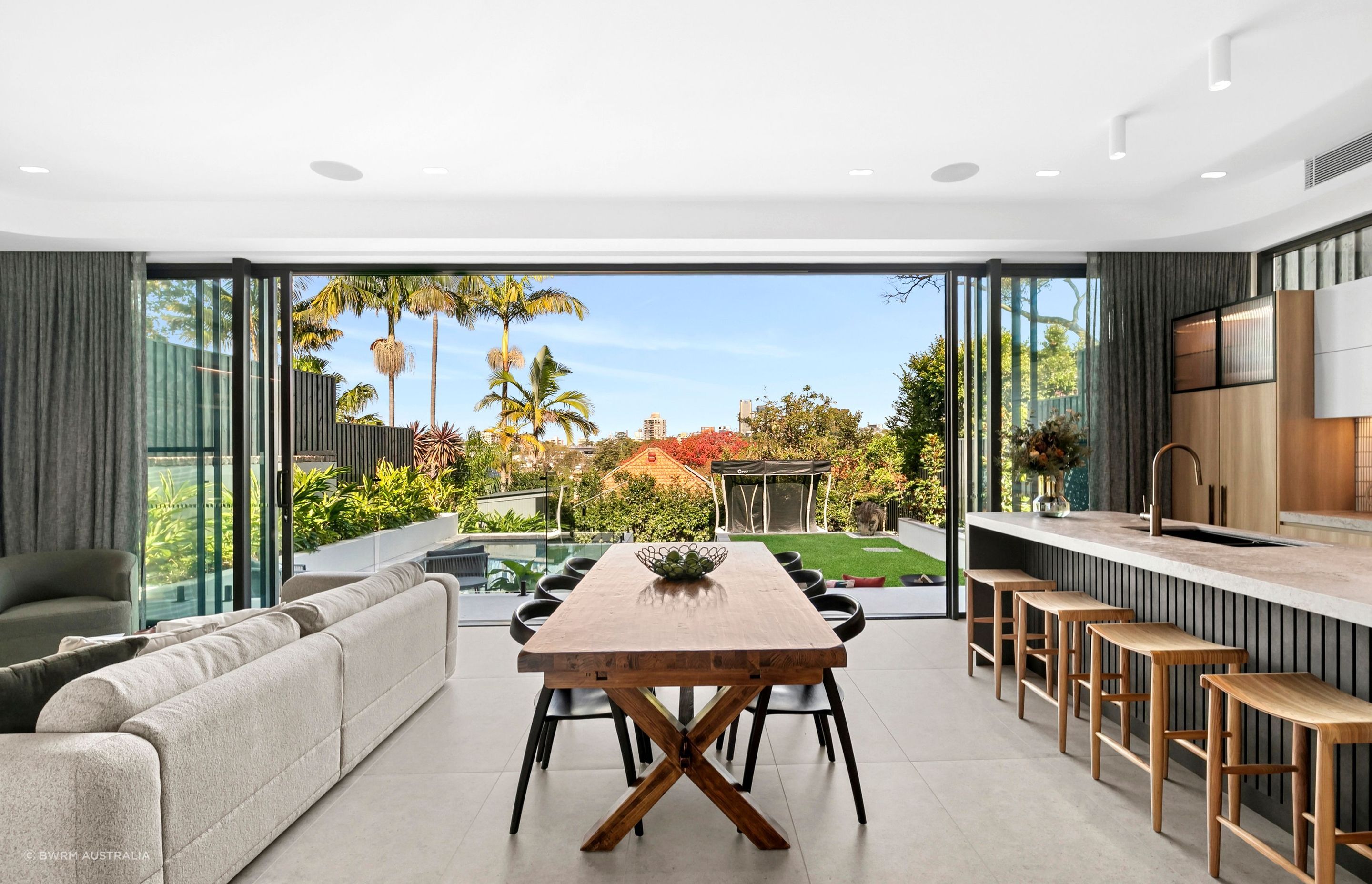Modern living with a leafy backyard outlook