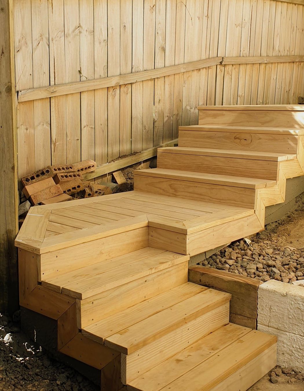 Pine decking stairs by Aries builders