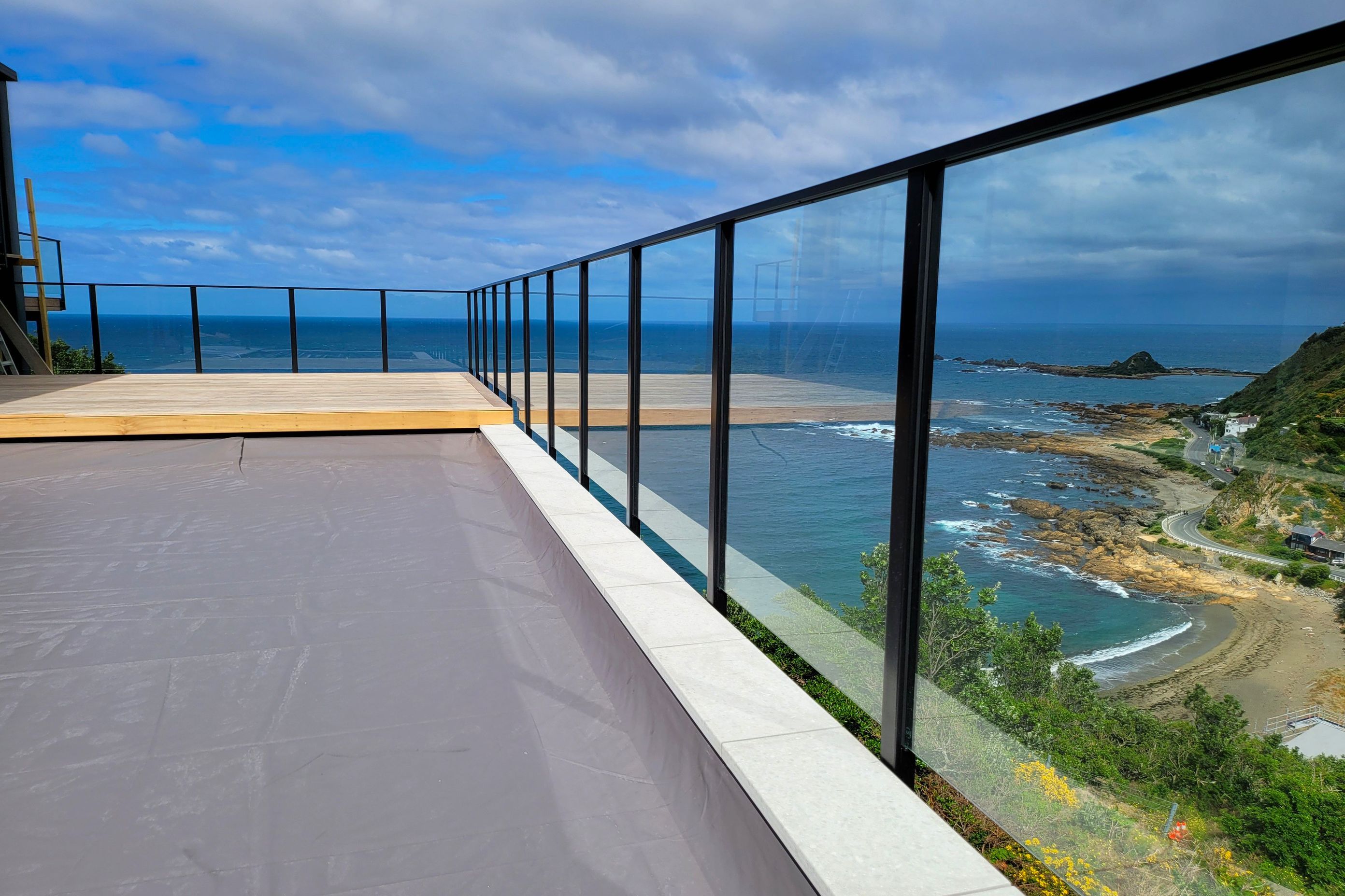A UNEX glass balustrade to enhance the impressive see views of this Wellington residence