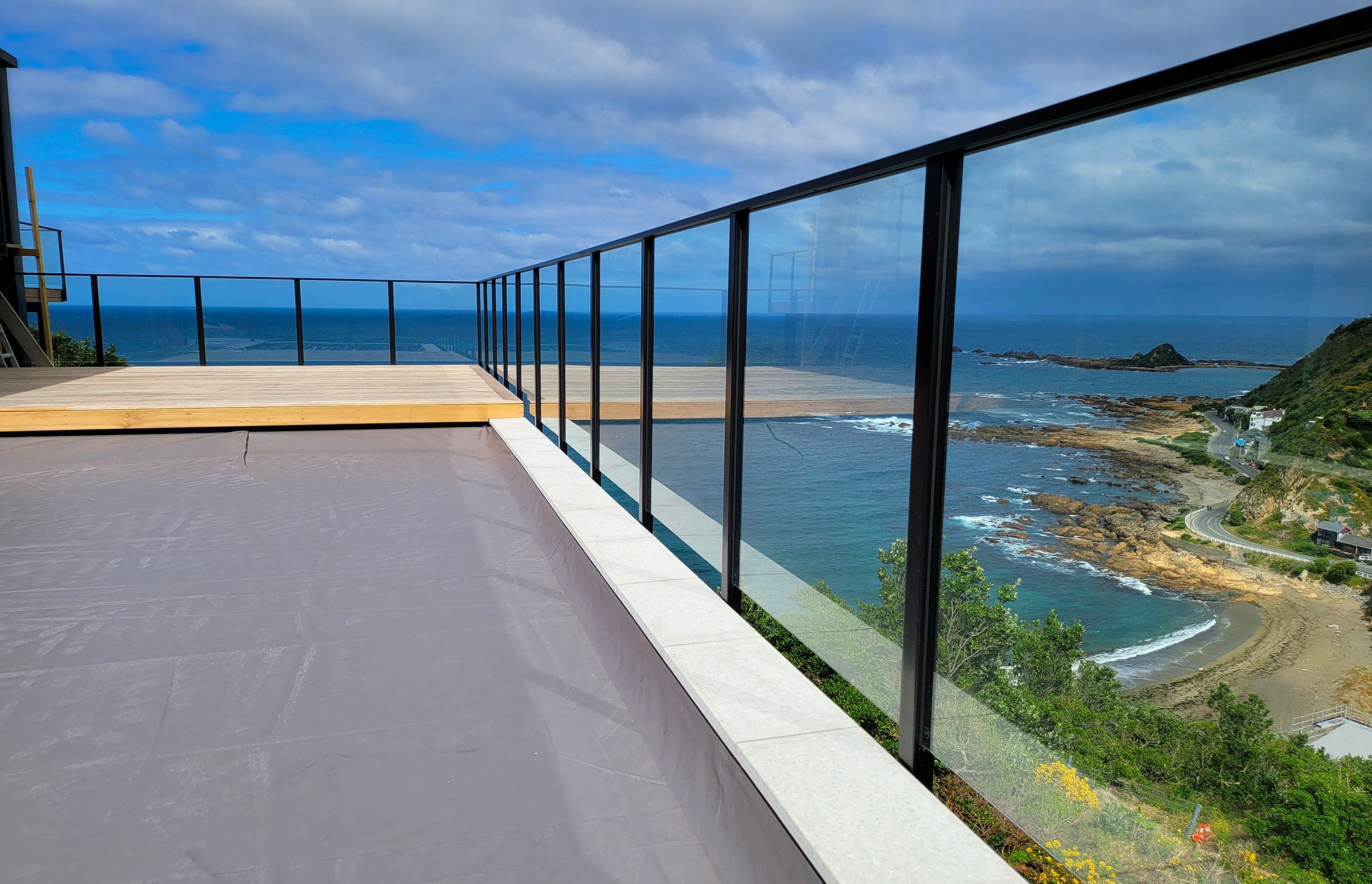 A UNEX glass balustrade to enhance the impressive see views of this Wellington residence