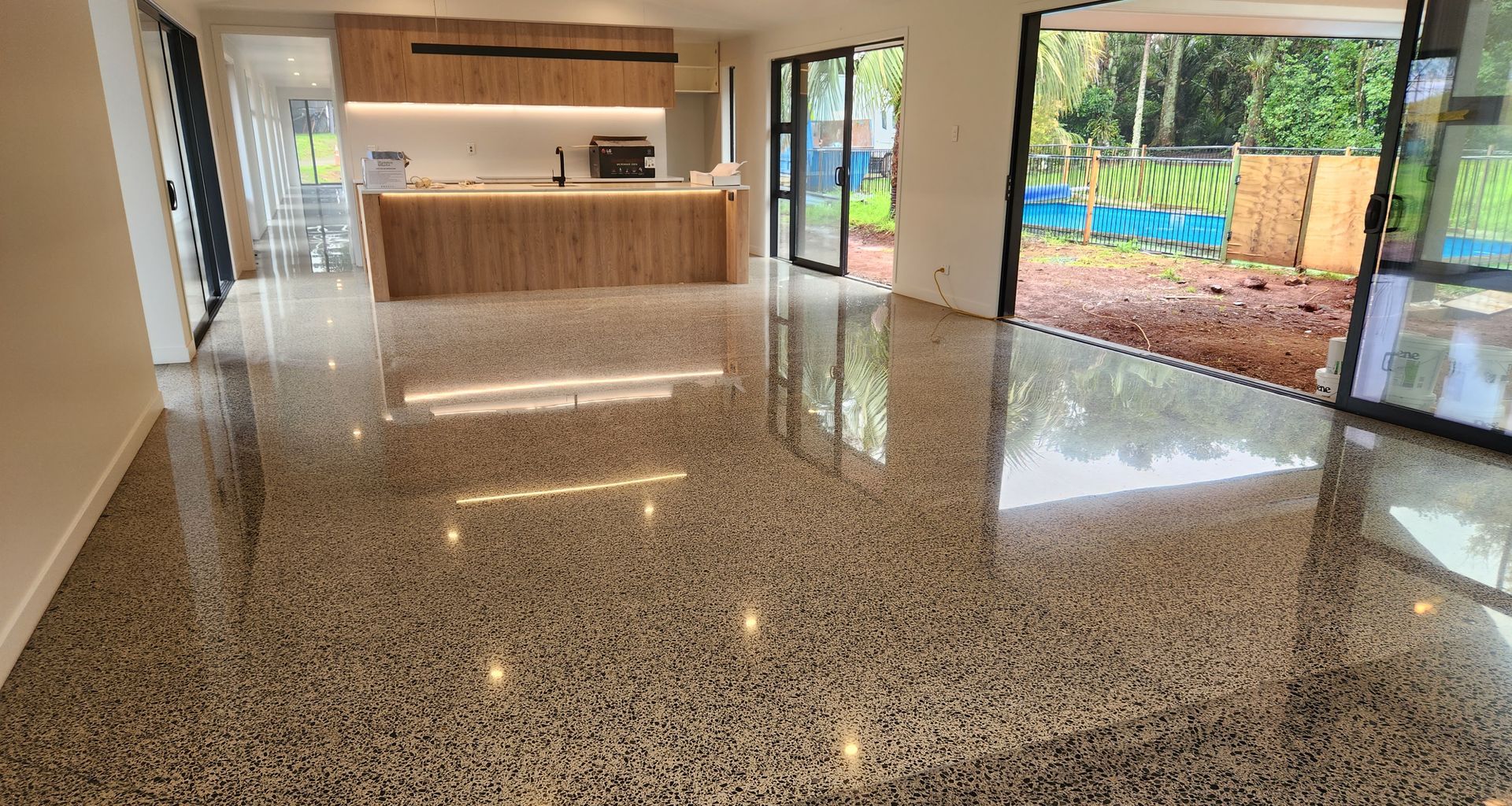A stunning, durable and low-maintenance polished concrete floor, showcasing the natural beauty of the aggregate.