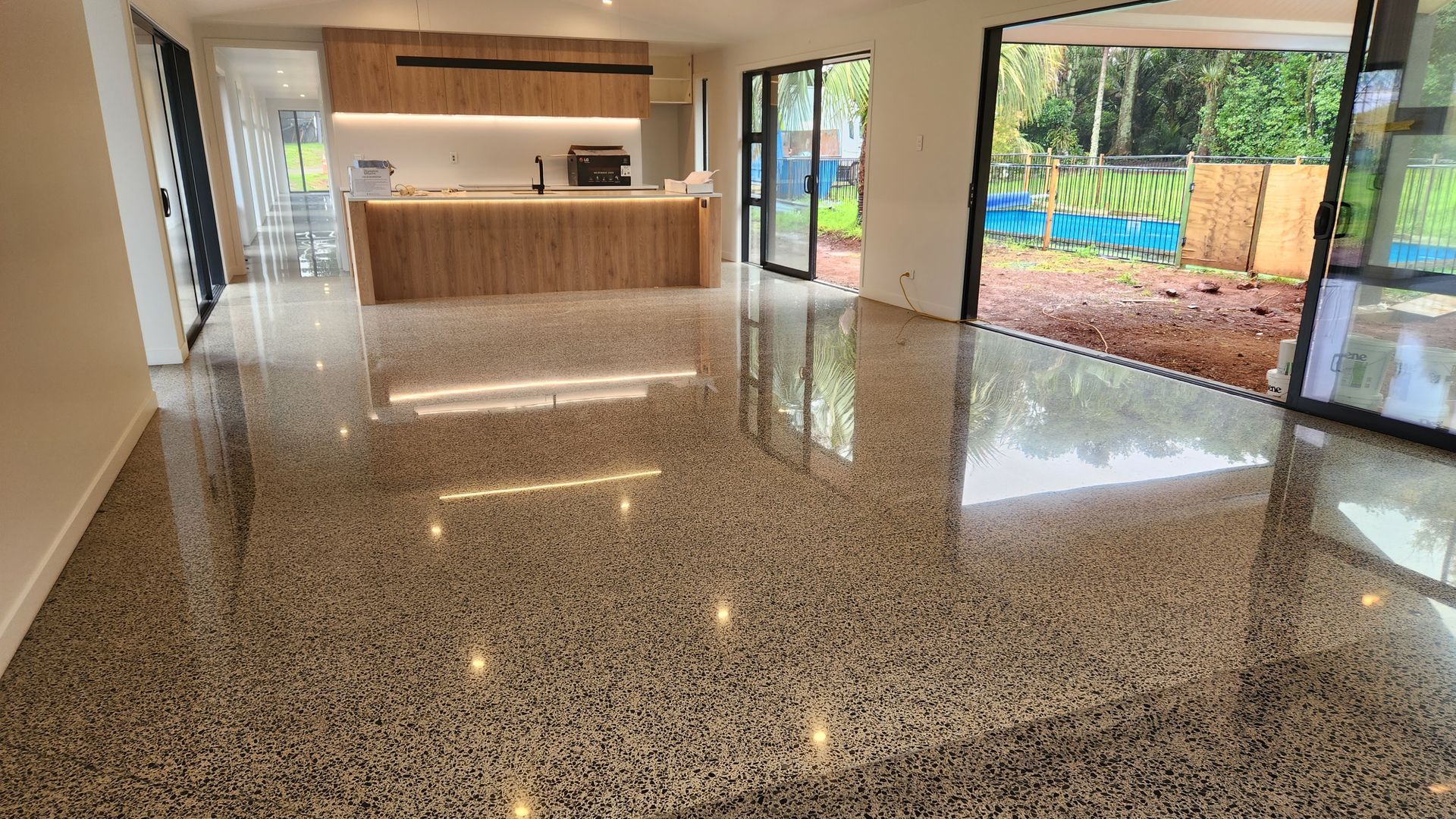 A stunning, durable and low-maintenance polished concrete floor, showcasing the natural beauty of the aggregate.