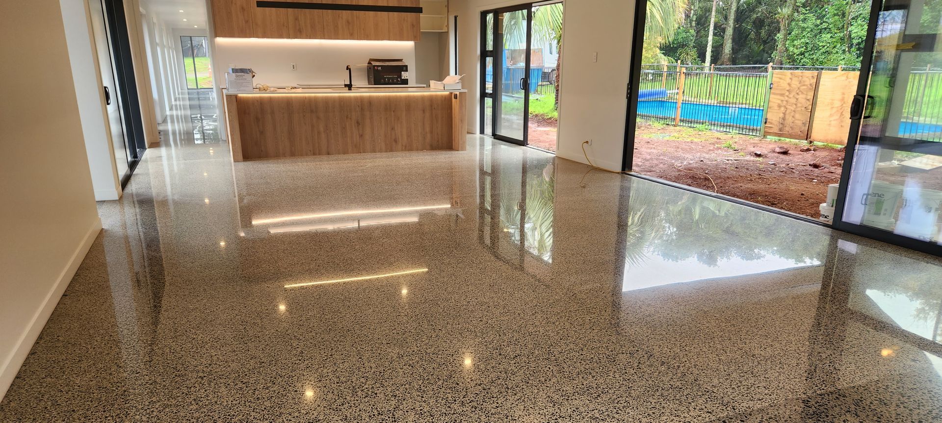 A stunning, durable and low-maintenance polished concrete floor, showcasing the natural beauty of the aggregate.
