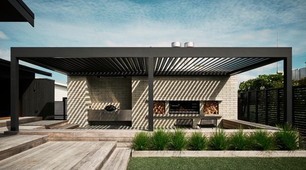 Contemporary outdoor entertaining area with a timber deck, built-in barbecue and fireplace set against a pale brick wall beneath a large dark louvred pergola. Black privacy screens, built-in bench seating, ornamental grasses and adjoining lawn frame the covered patio, creating a structured backyard courtyard setting.