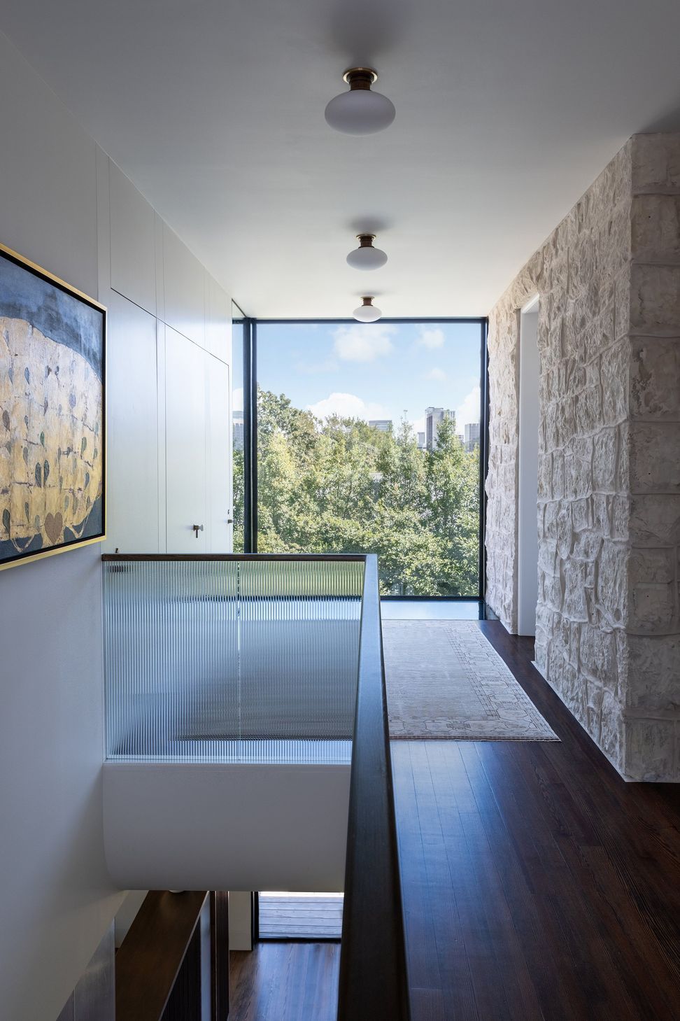 20PastandPresentPlaceCuppettKilpatrickArchitectureandInteriorDesignAustinTexashistori-renovation-addition-stone-wall-stair-hall-ribbed-glass-connector.jpg