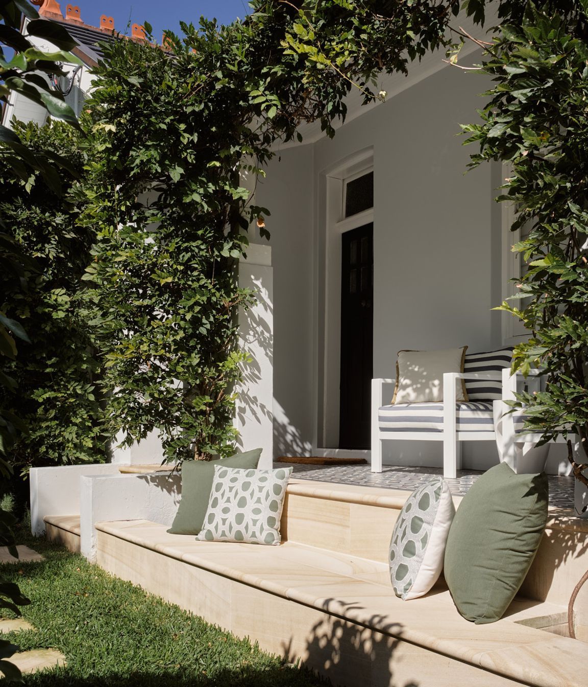 Addition of the stone bench completes the repurpose of the green space on the northern elevation of the dwelling.