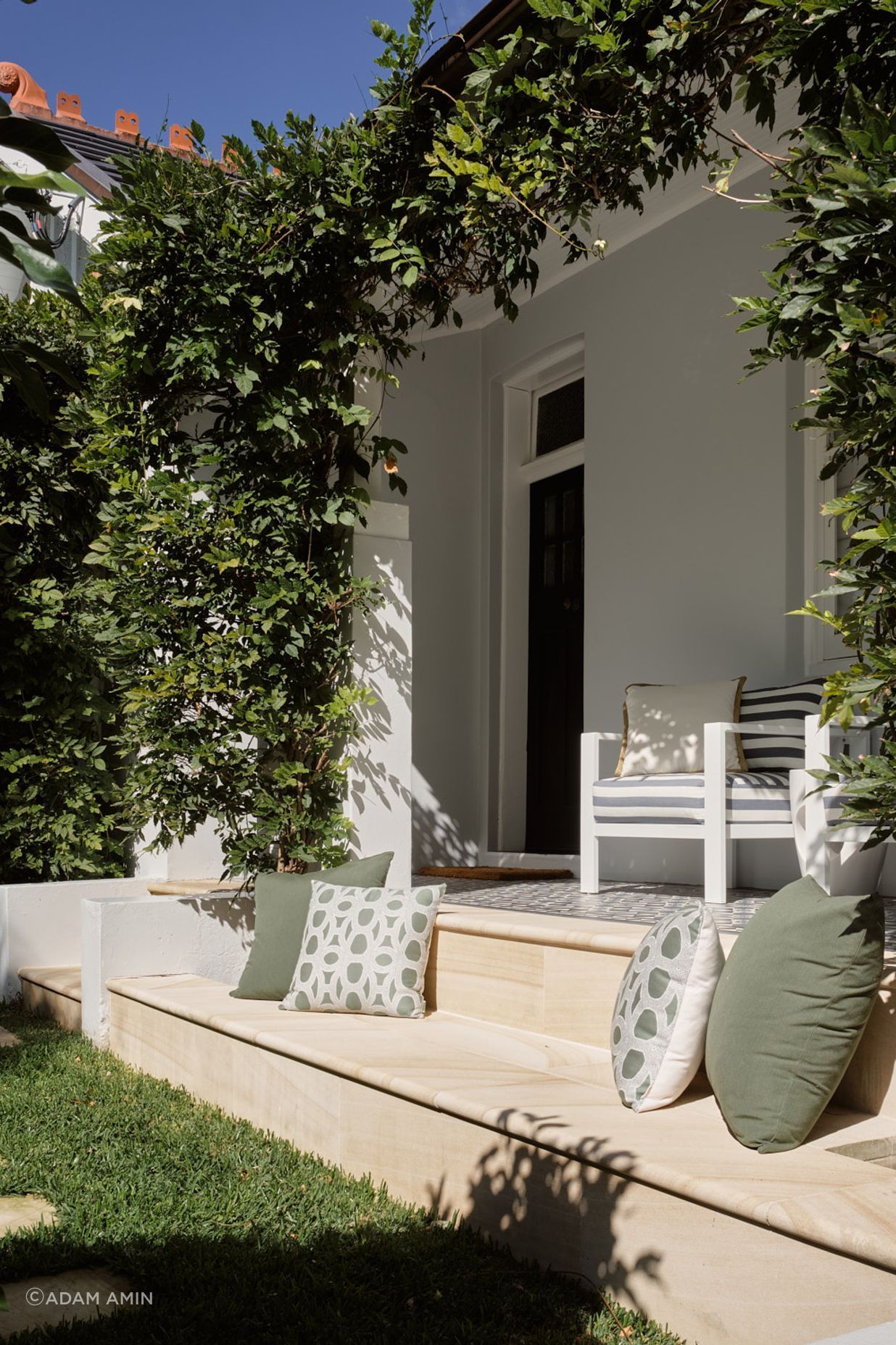 Addition of the stone bench completes the repurpose of the green space on the northern elevation of the dwelling.