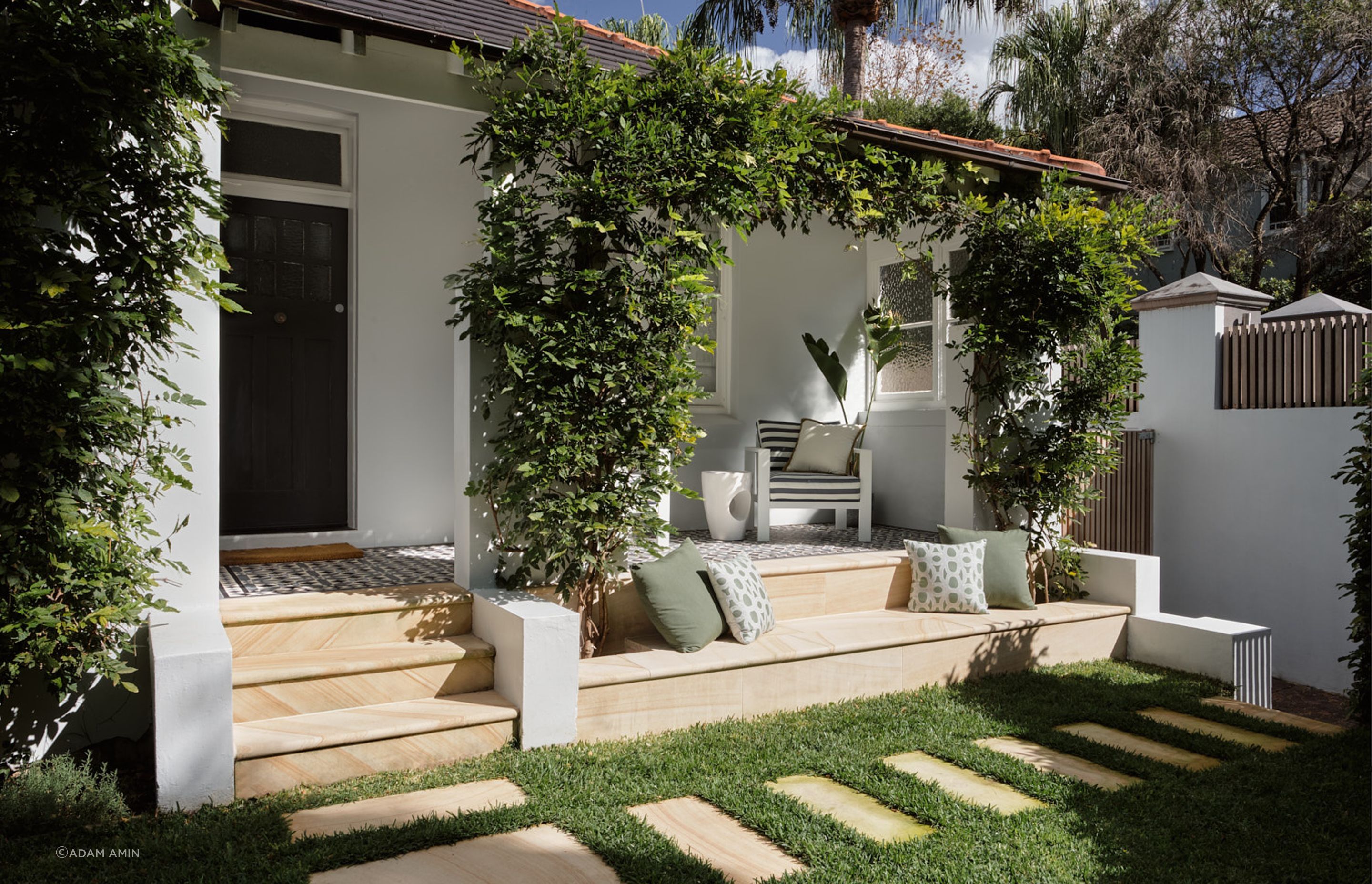 The use of sandstone and tessellated tiles on the front porch maintains character of a federation home of the era.