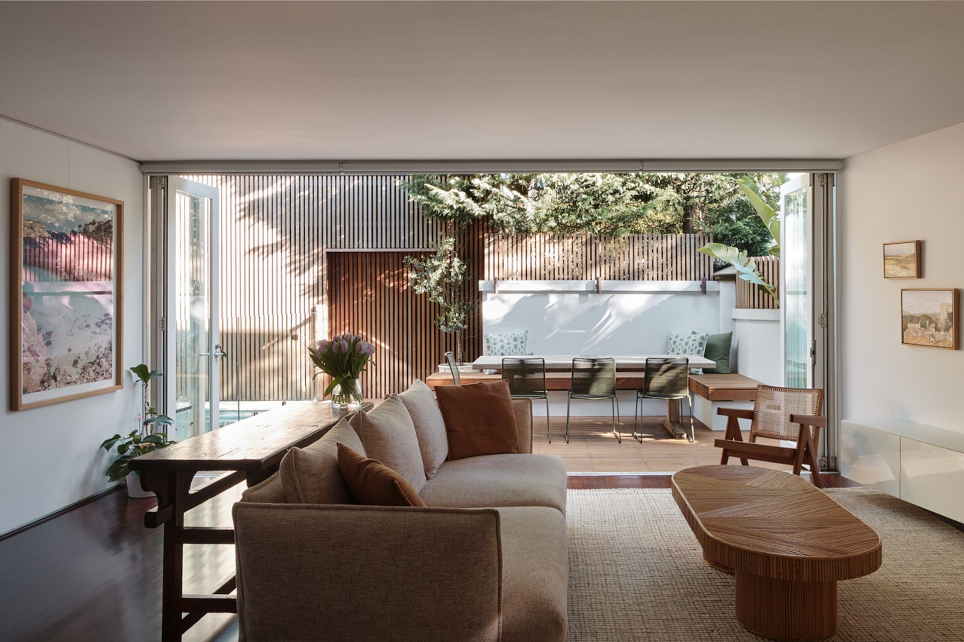 The indoor living space is connected to the outdoor entertaining space via double bi-fold doors.