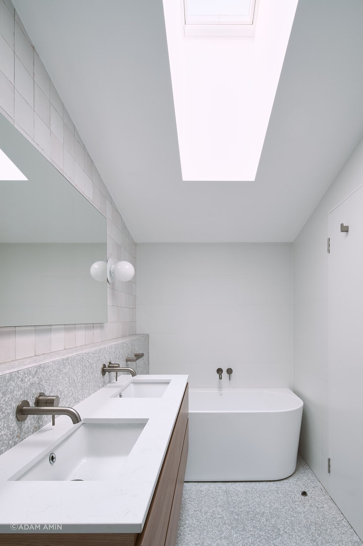 Introducing large skylights into the southern spaces within the home allows for natural light to enter, limiting the dependence on artificial lighting.