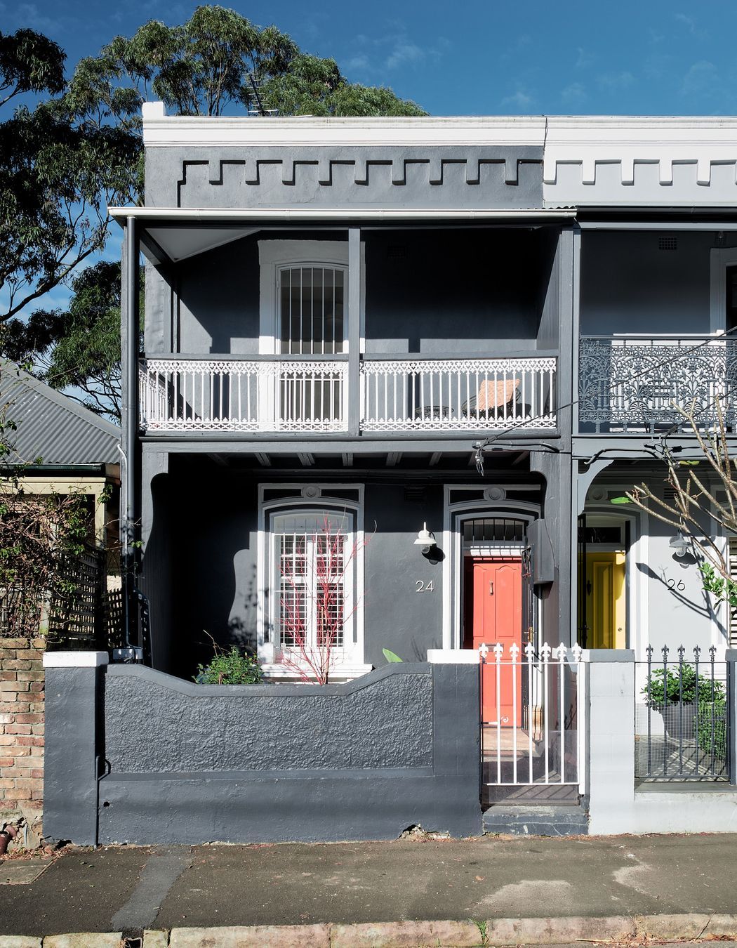 The Victorian terrace frontage, iconic to the streetscape, has been restored with modern hues.