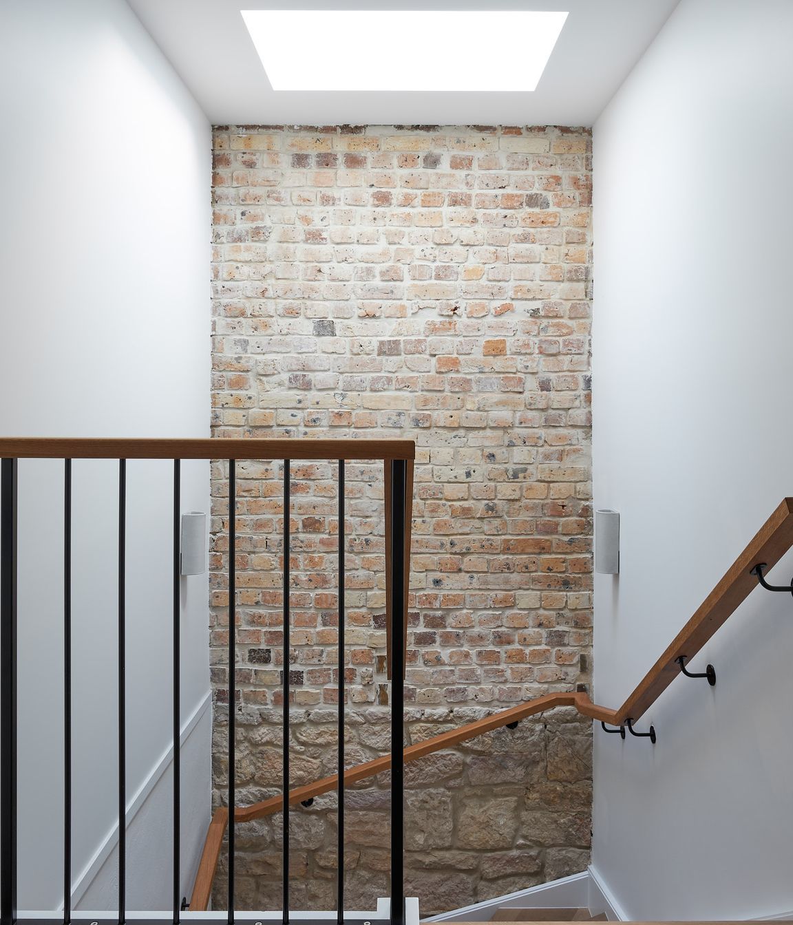 Previous home occupants have left a timestamp through layering various materials used during the respective construction periods. These have been celebrated, making centrepieces and visual interests of the home.