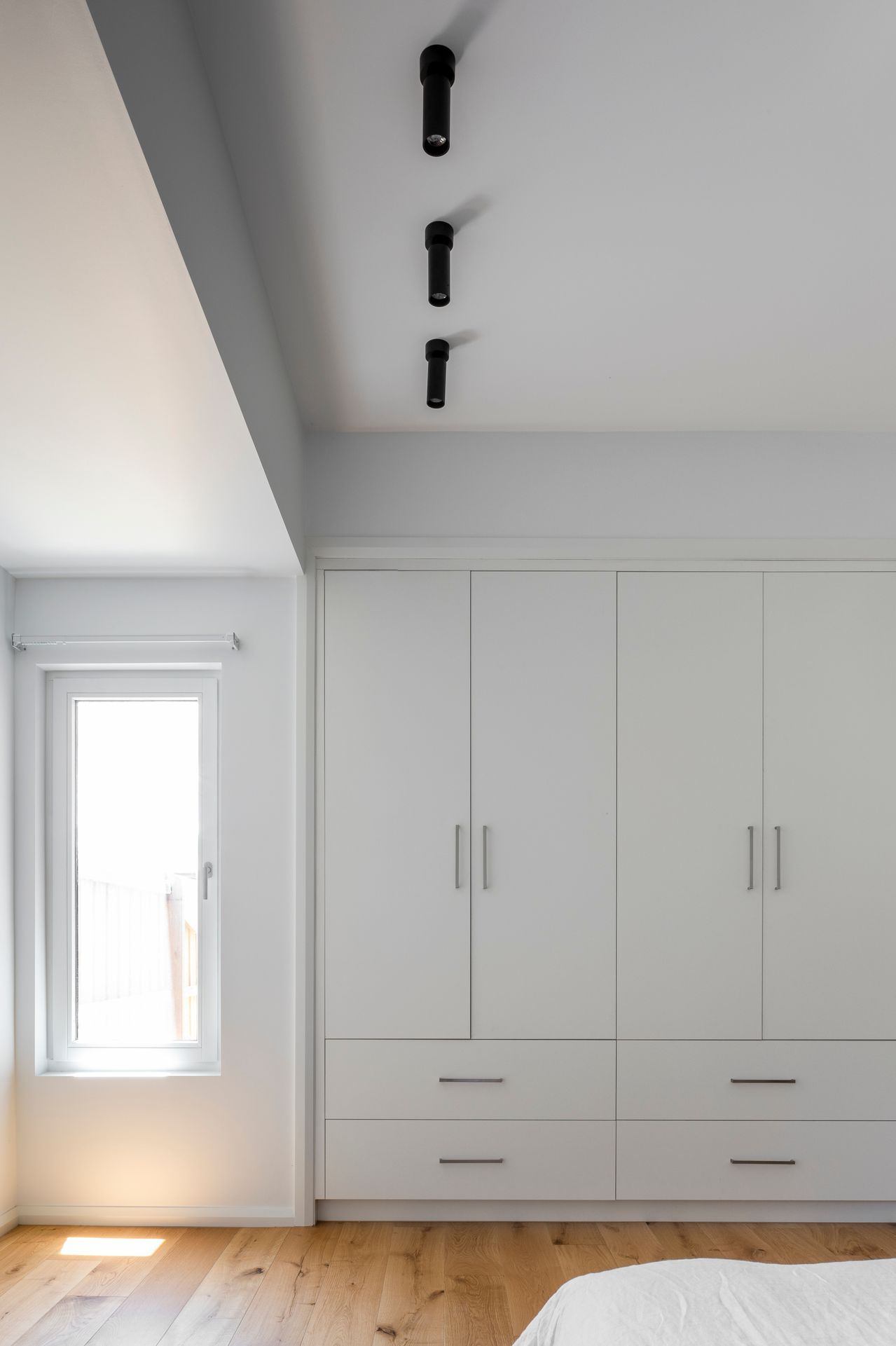 Built in robe and window provide space and light in the upstairs addition