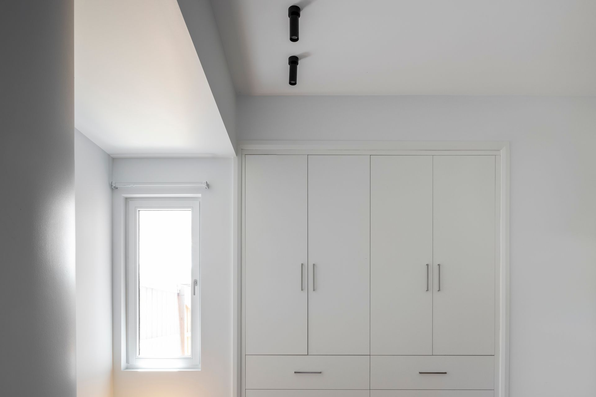 Built in robe and window provide space and light in the upstairs addition