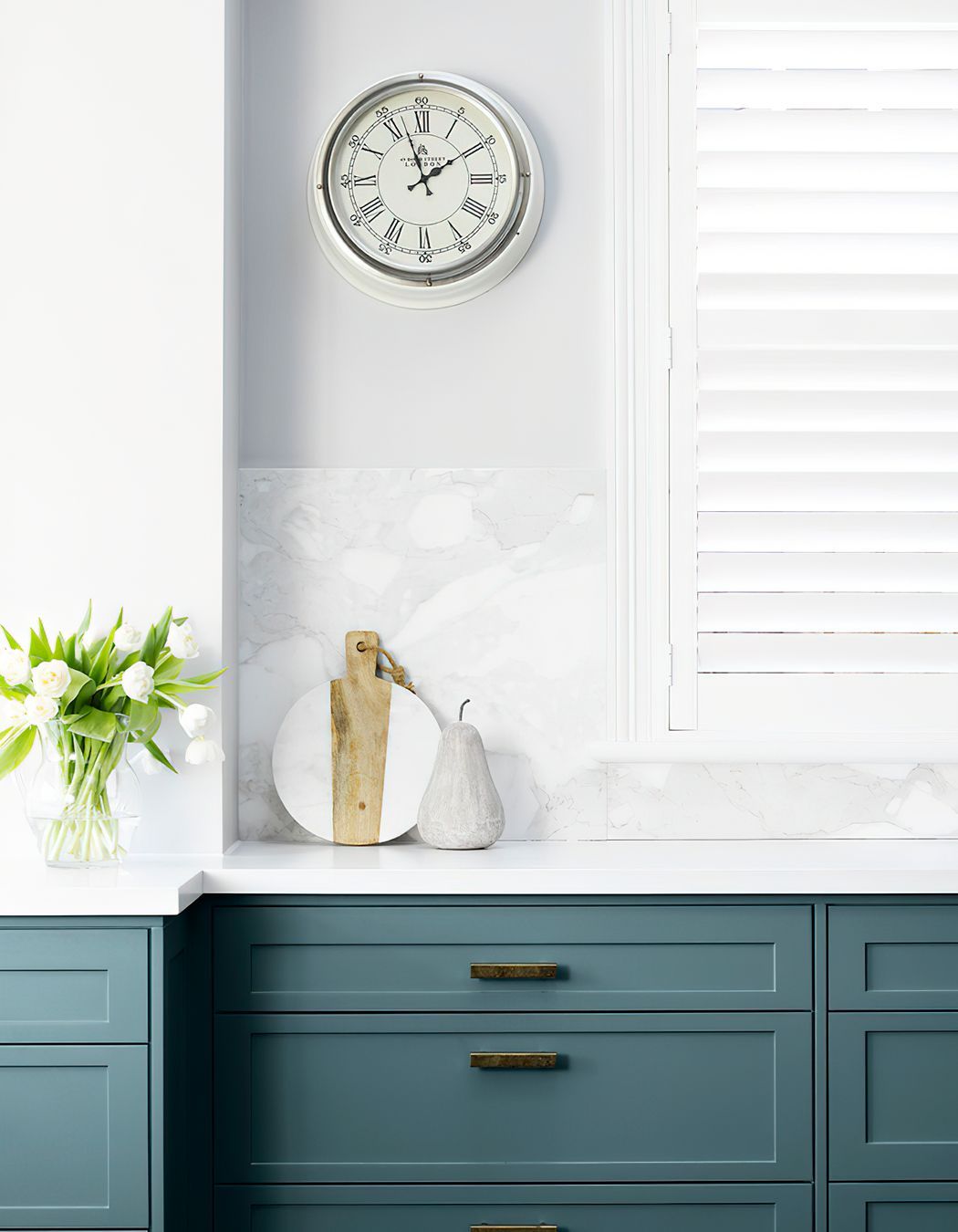 HAND PAINTED KITCHEN JOINERY - The blue grey joinery was hand painted in this kitchen, perfectly complemented with the crisp white benchtops and splashback.