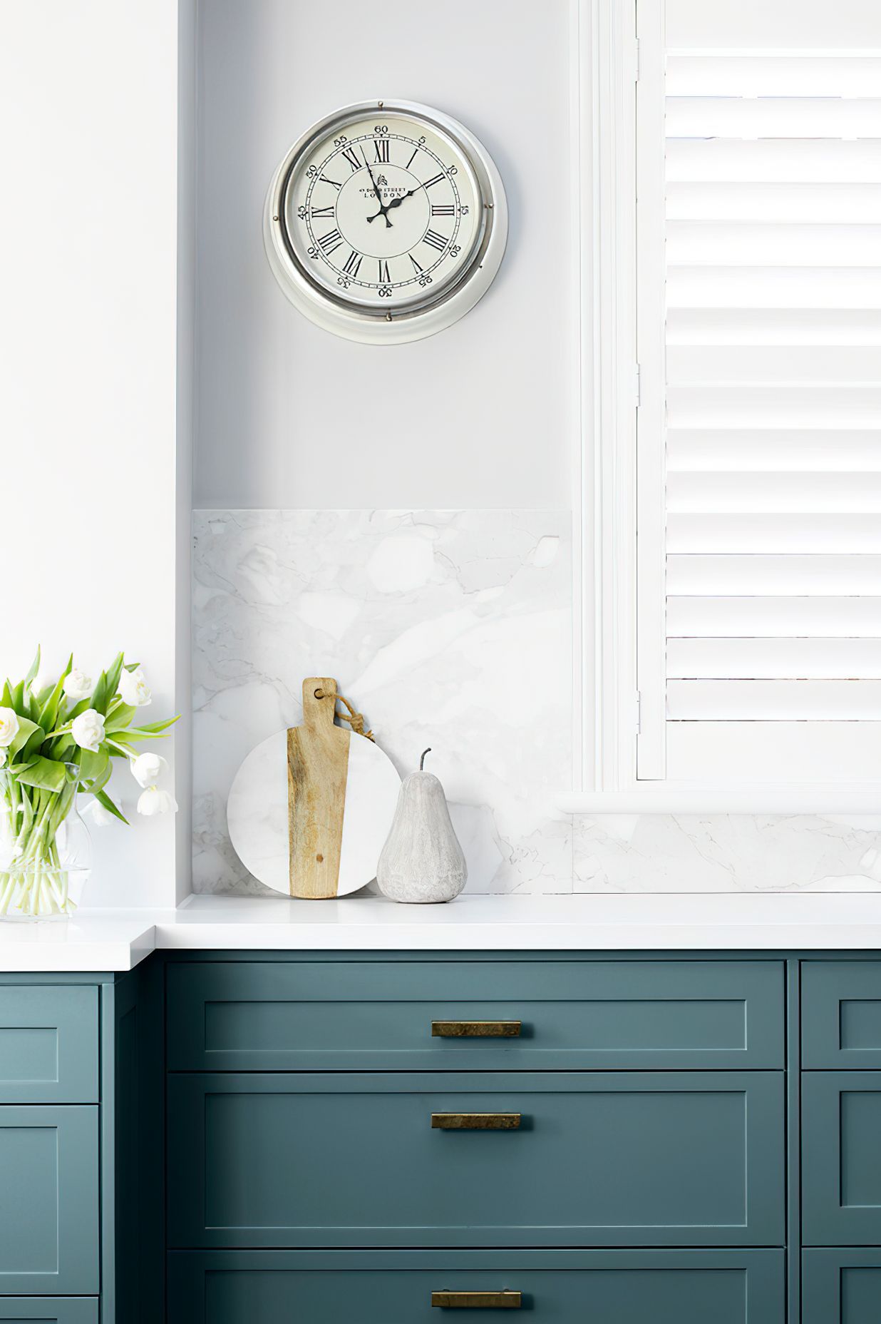 HAND PAINTED KITCHEN JOINERY - The blue grey joinery was hand painted in this kitchen, perfectly complemented with the crisp white benchtops and splashback.