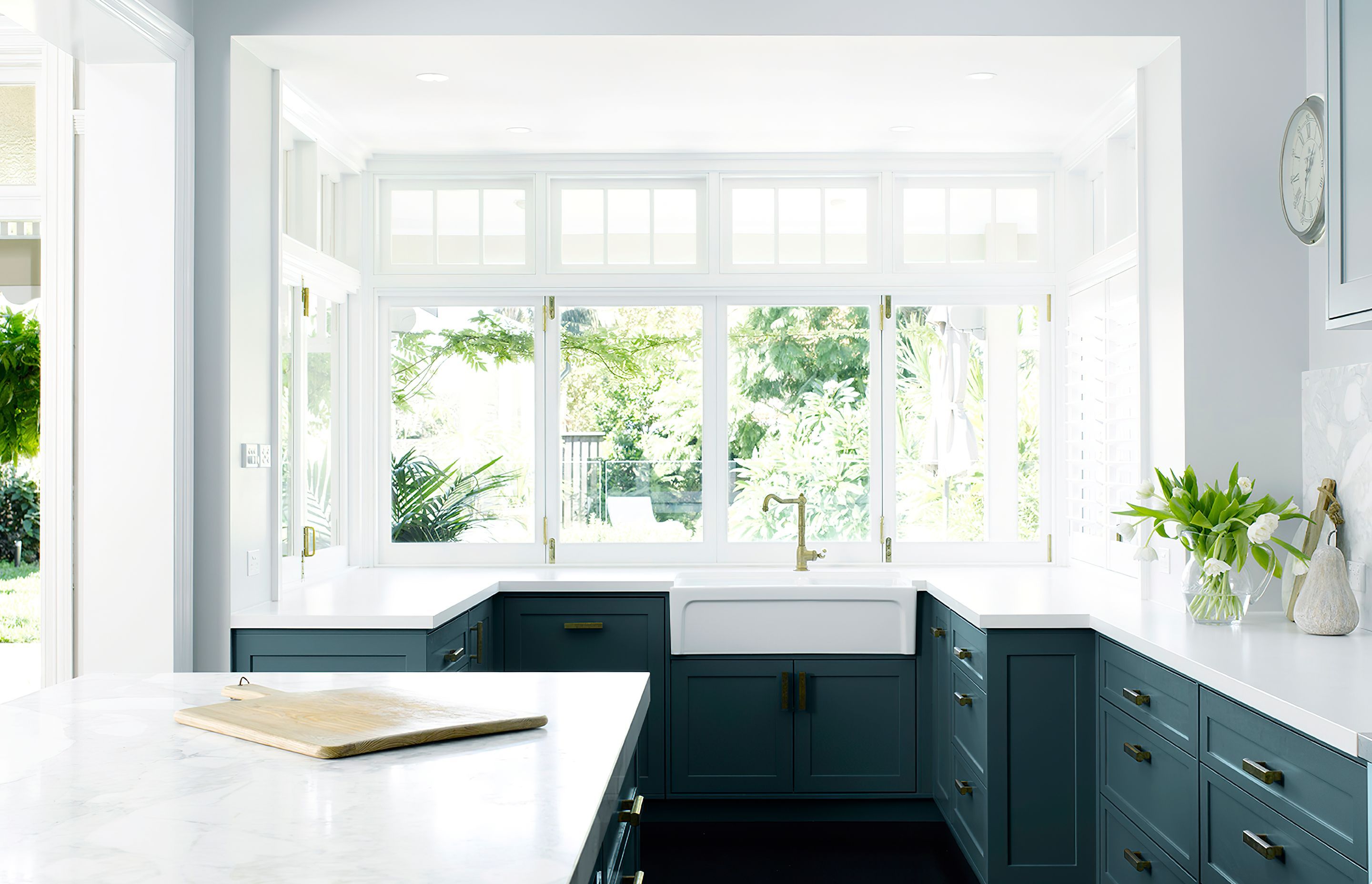 KITCHEN OVERLOOKING THE BACKYARD - The sink and wet area were formerly a built in dining area. We transformed the space into something more user friendly, making it easier to keep an eye on the kids when they play outdoors.