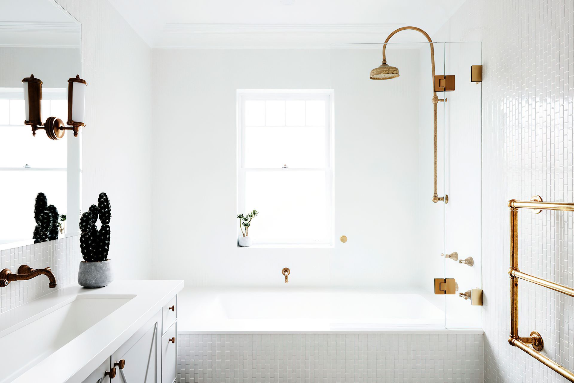 WHITE BATHROOM WITH CHROME HIGHLIGHTS - This spacious, white bathroom was entirely renovated and is mostly used by the children in the family. The chrome theme that is played out through the home is featured in the tapware.