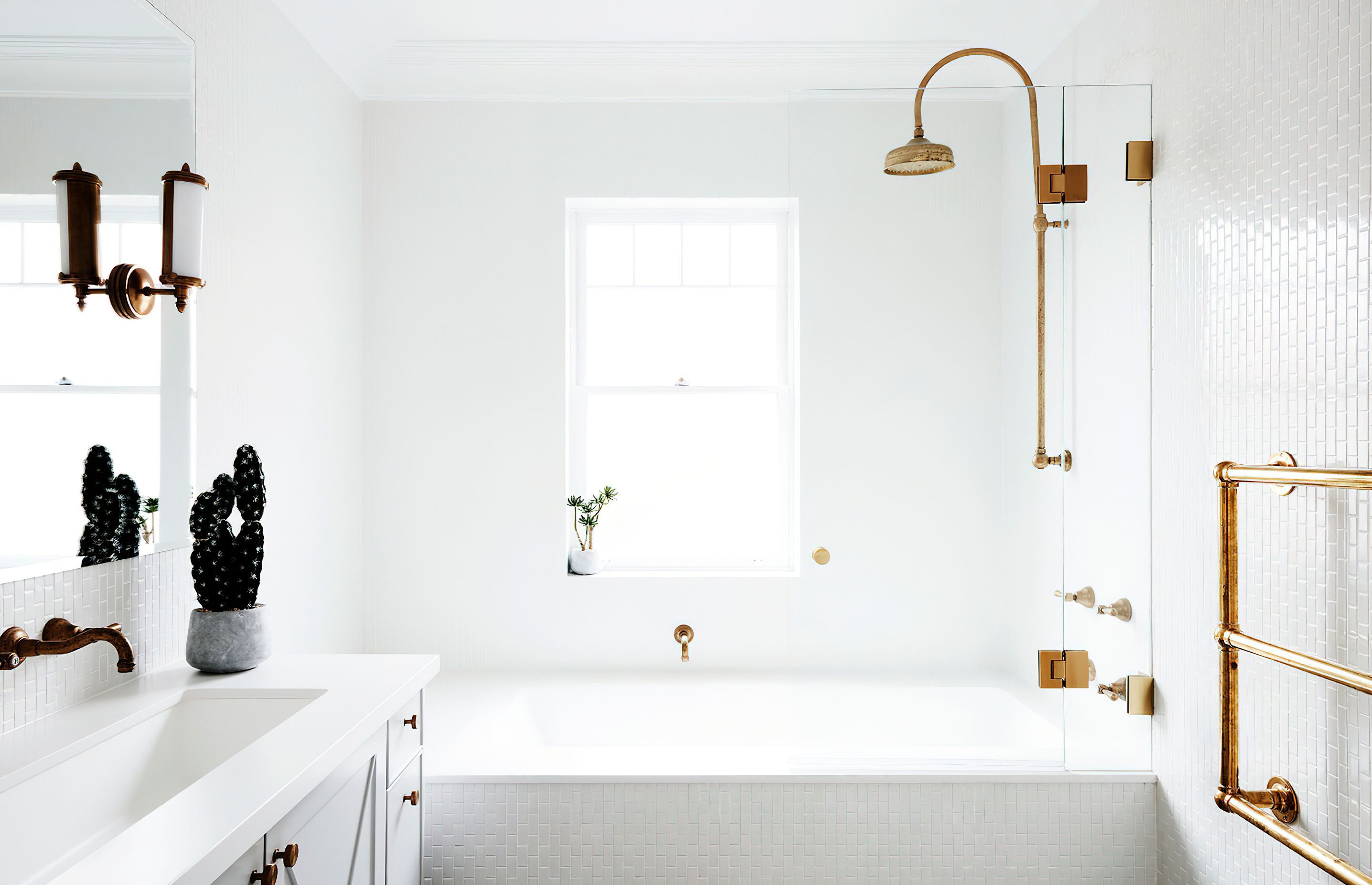 WHITE BATHROOM WITH CHROME HIGHLIGHTS - This spacious, white bathroom was entirely renovated and is mostly used by the children in the family. The chrome theme that is played out through the home is featured in the tapware.