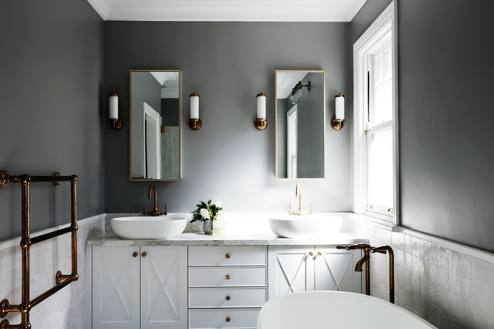 ELEGANT ENSUITE - An elegant ensuite was created for two, featuring hand cut Moroccan tiles, chrome tapware and lighting, and grey walls.