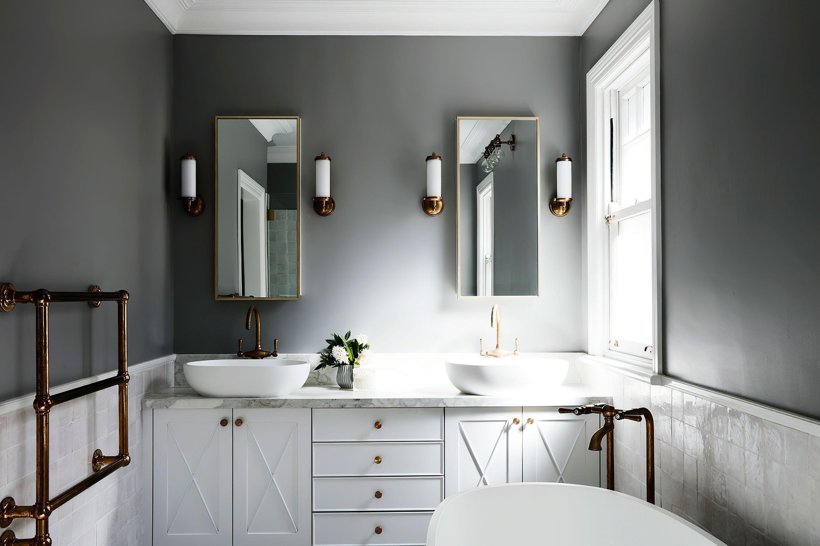 ELEGANT ENSUITE - An elegant ensuite was created for two, featuring hand cut Moroccan tiles, chrome tapware and lighting, and grey walls.