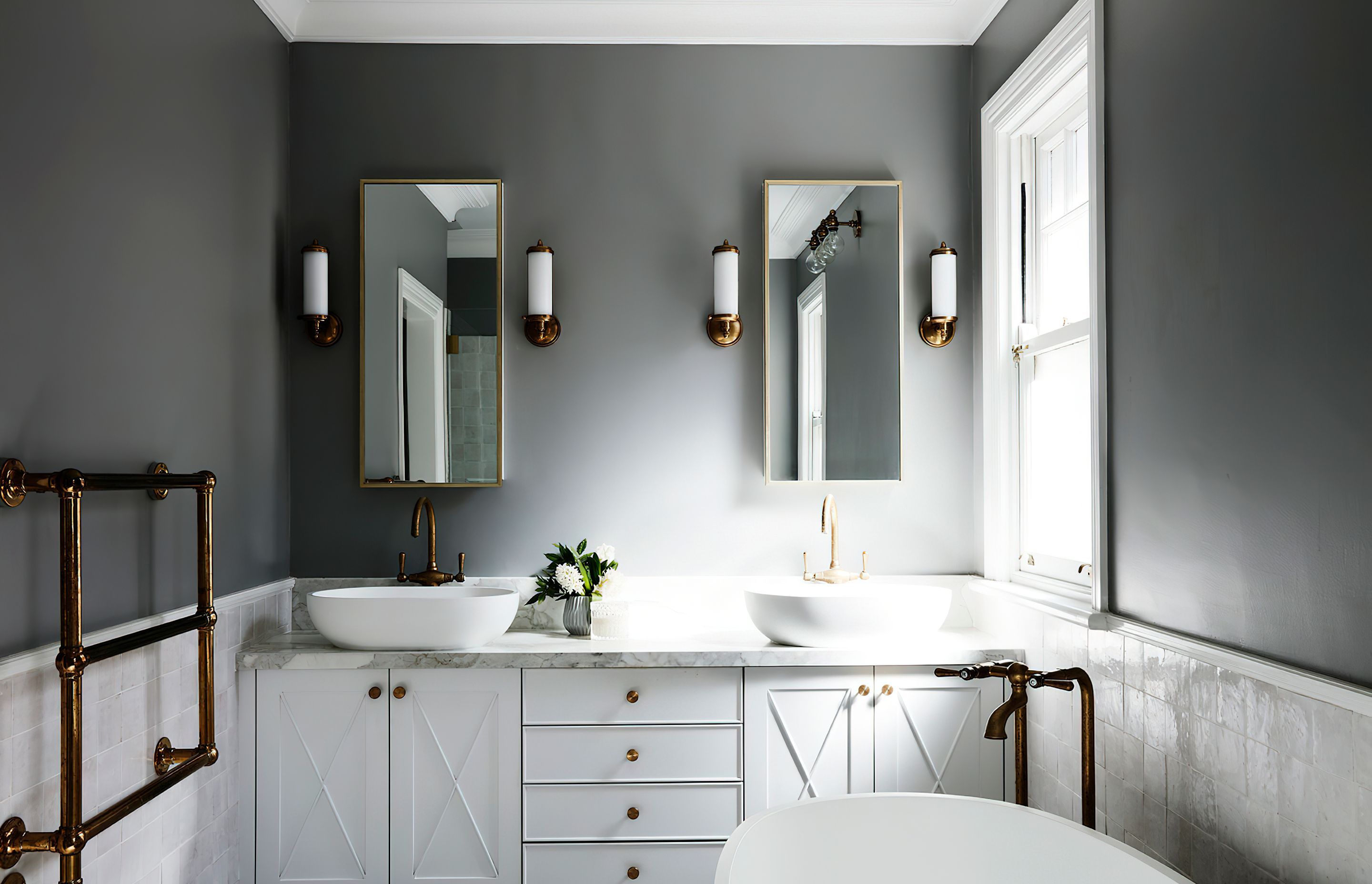 ELEGANT ENSUITE - An elegant ensuite was created for two, featuring hand cut Moroccan tiles, chrome tapware and lighting, and grey walls.