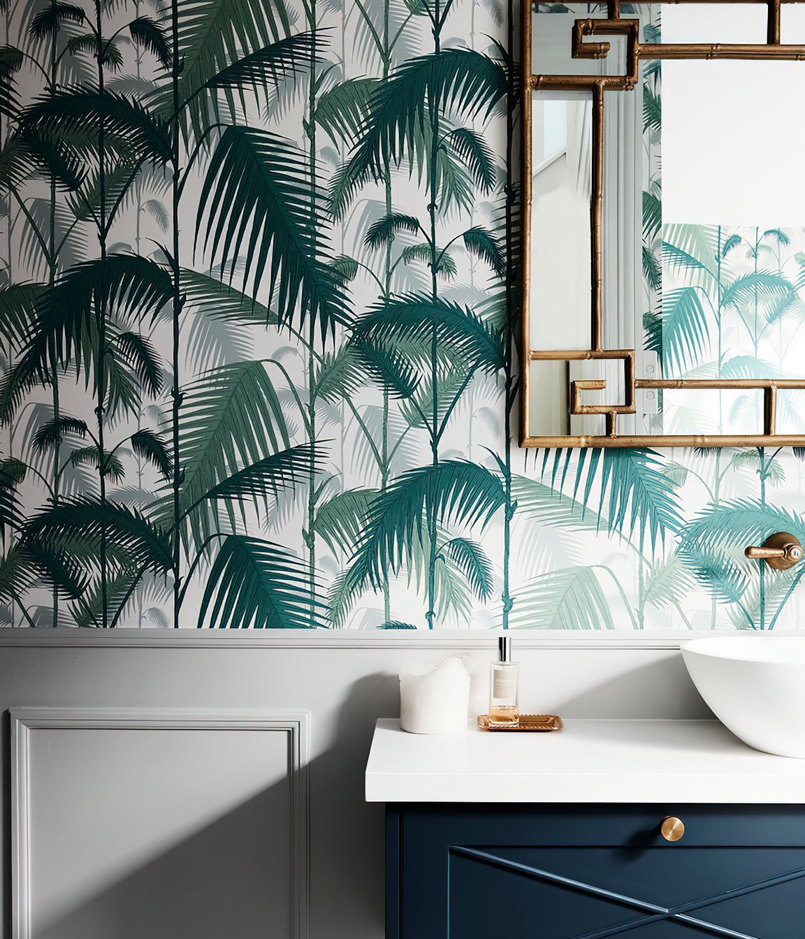 BRITISH COLONIAL STYLE POWDER ROOM - This powder room packs a punch featuring fern wallpaper, custom joinery and chrome bamboo framed mirror.