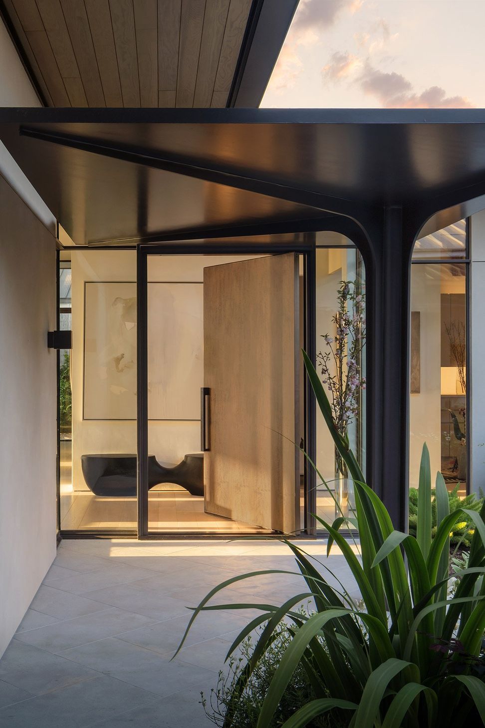 2HighontheHillCuppettKilpatrickArchitectureandInteriorDesignmodern-entryway-design-pivot-door.jpg