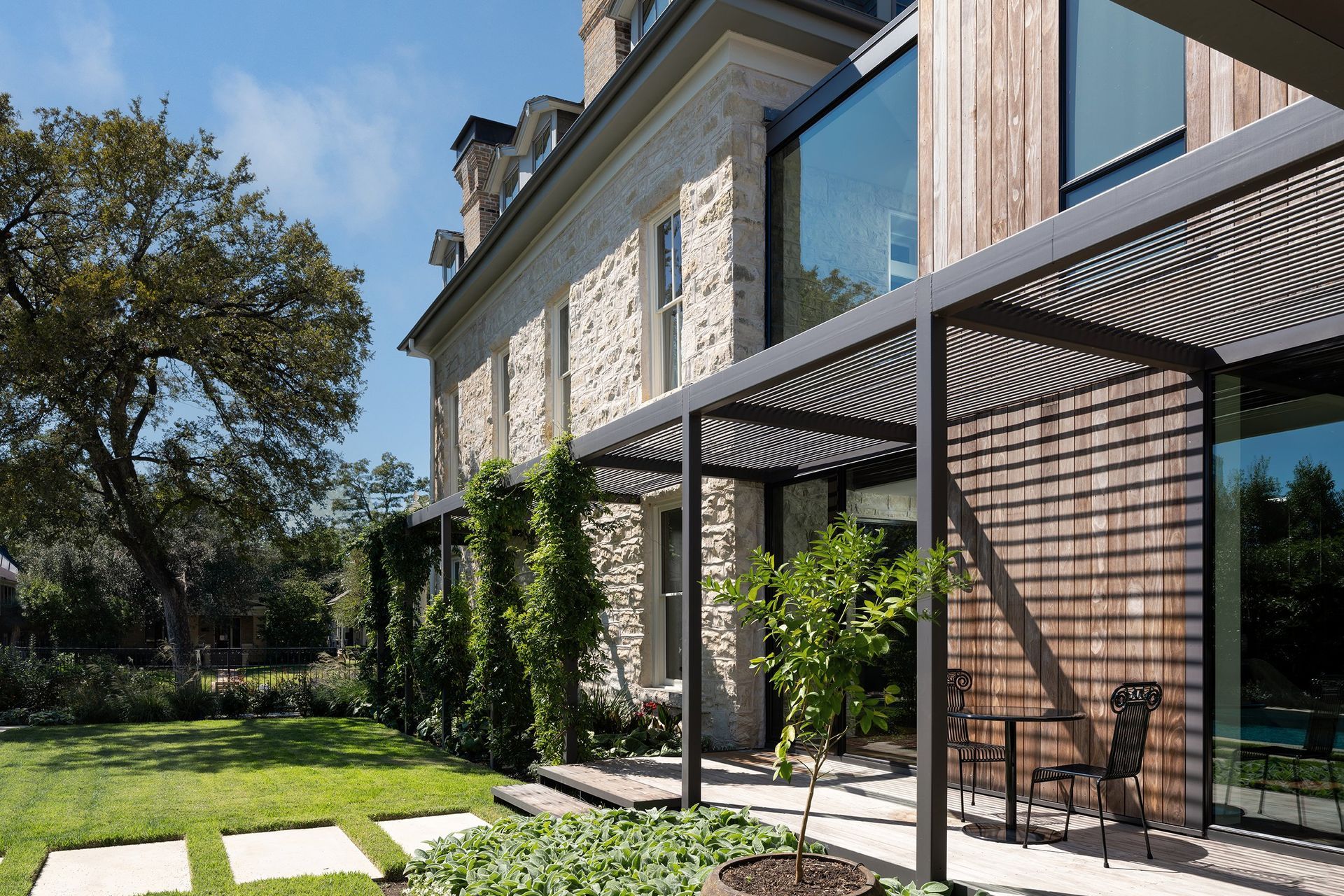 30PastandPresentPlaceCuppettKilpatrickArchitectureandInteriorDesignAustinTexasstone-secondempire-historic-addition-exterior-steel-trellis-kebony-siding.jpg