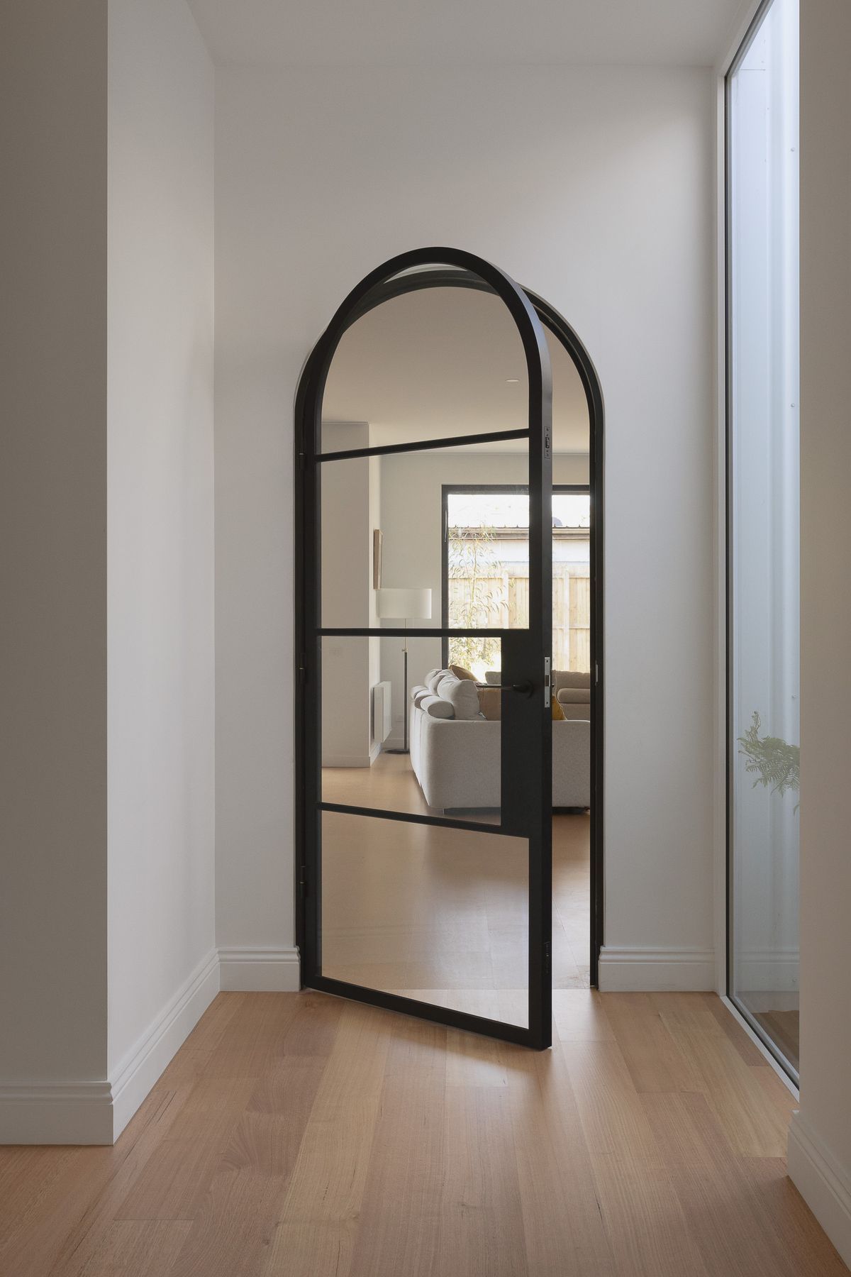 473BlackArchedMetalDoorYarraville.jpg
