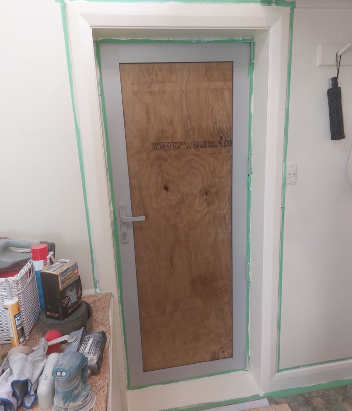 5-19-Tweed-St-Roslyn-Dunedin-Interior-showing-newly-installed-back-door-being-painted-double-glazing-to-be-installed-in-the-next-few-days-JDBuilders.jpg